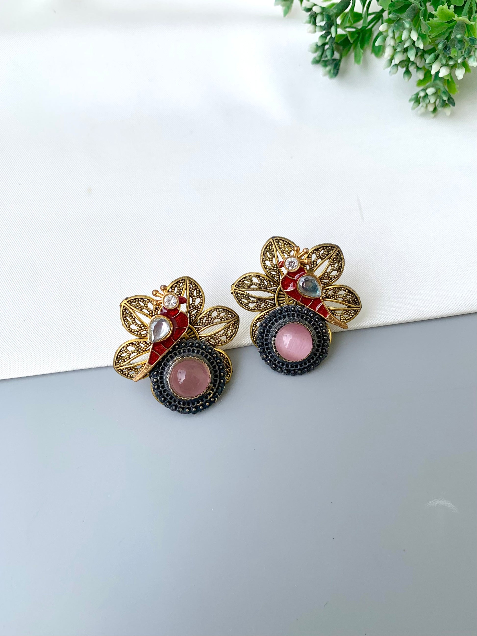 Maya pink polki kundan earrings in gold plating with oxidized finish