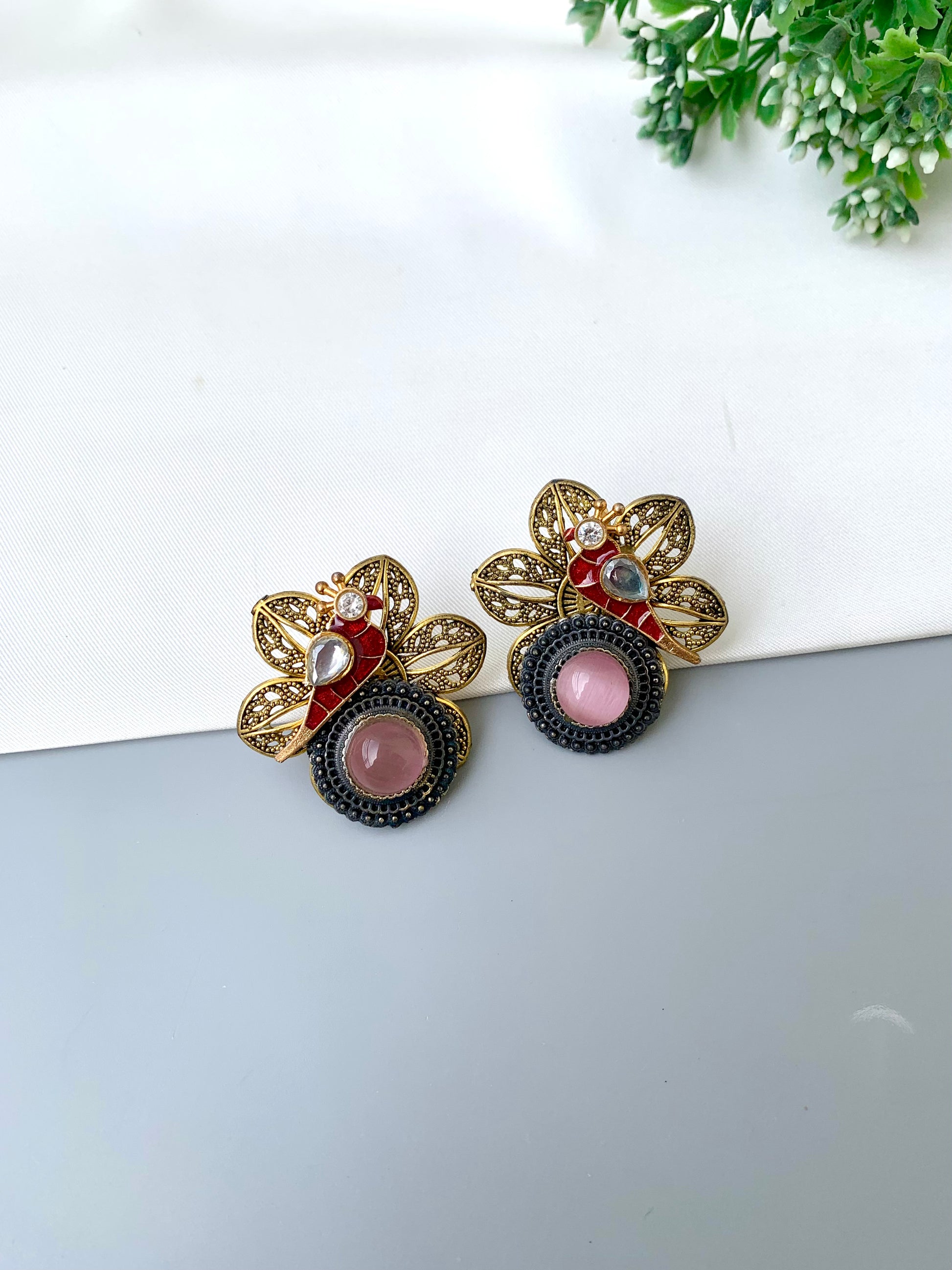 Maya pink polki kundan earrings in gold plating with oxidized finish
