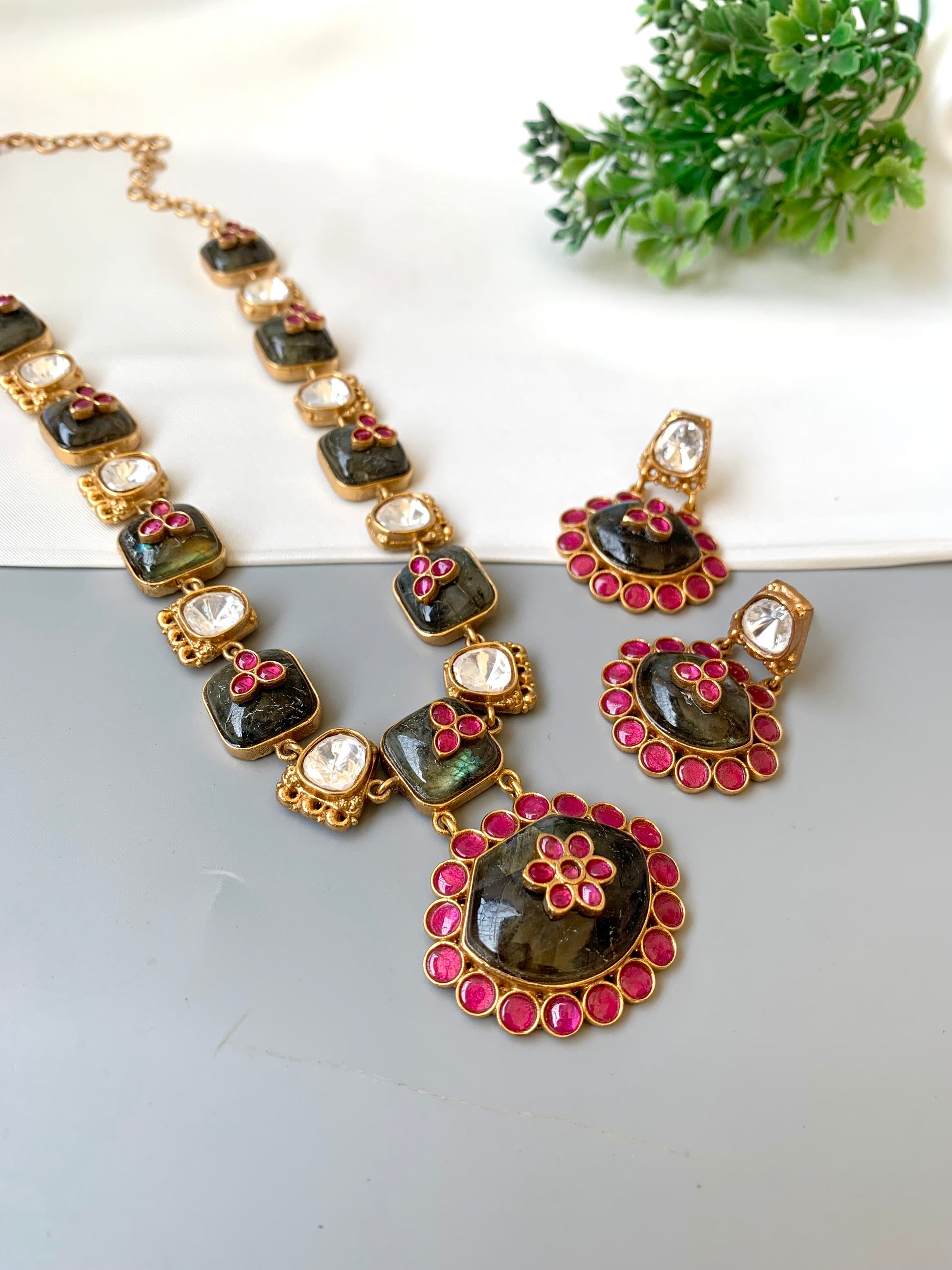 Jewelry set with necklace and earrings on a white background