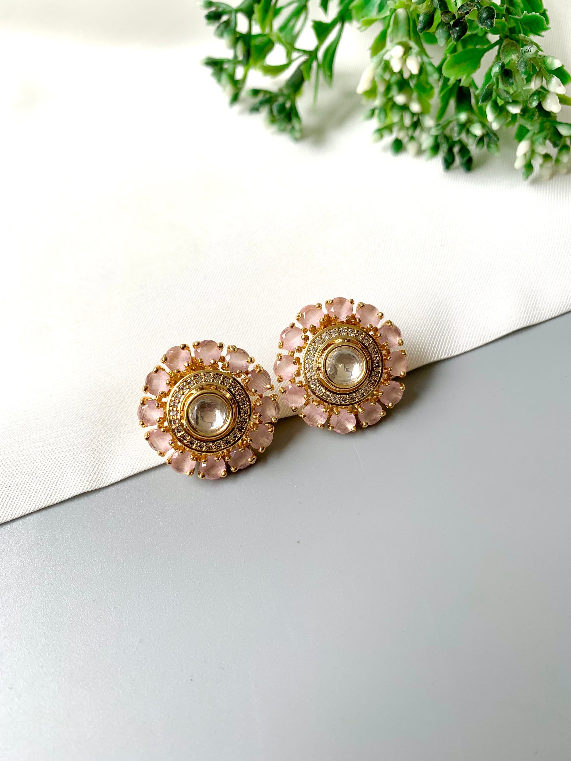 Handcrafted 22kt Rose Gold studs with pastel pink Polki Kundan and American Diamonds, front view on white background.