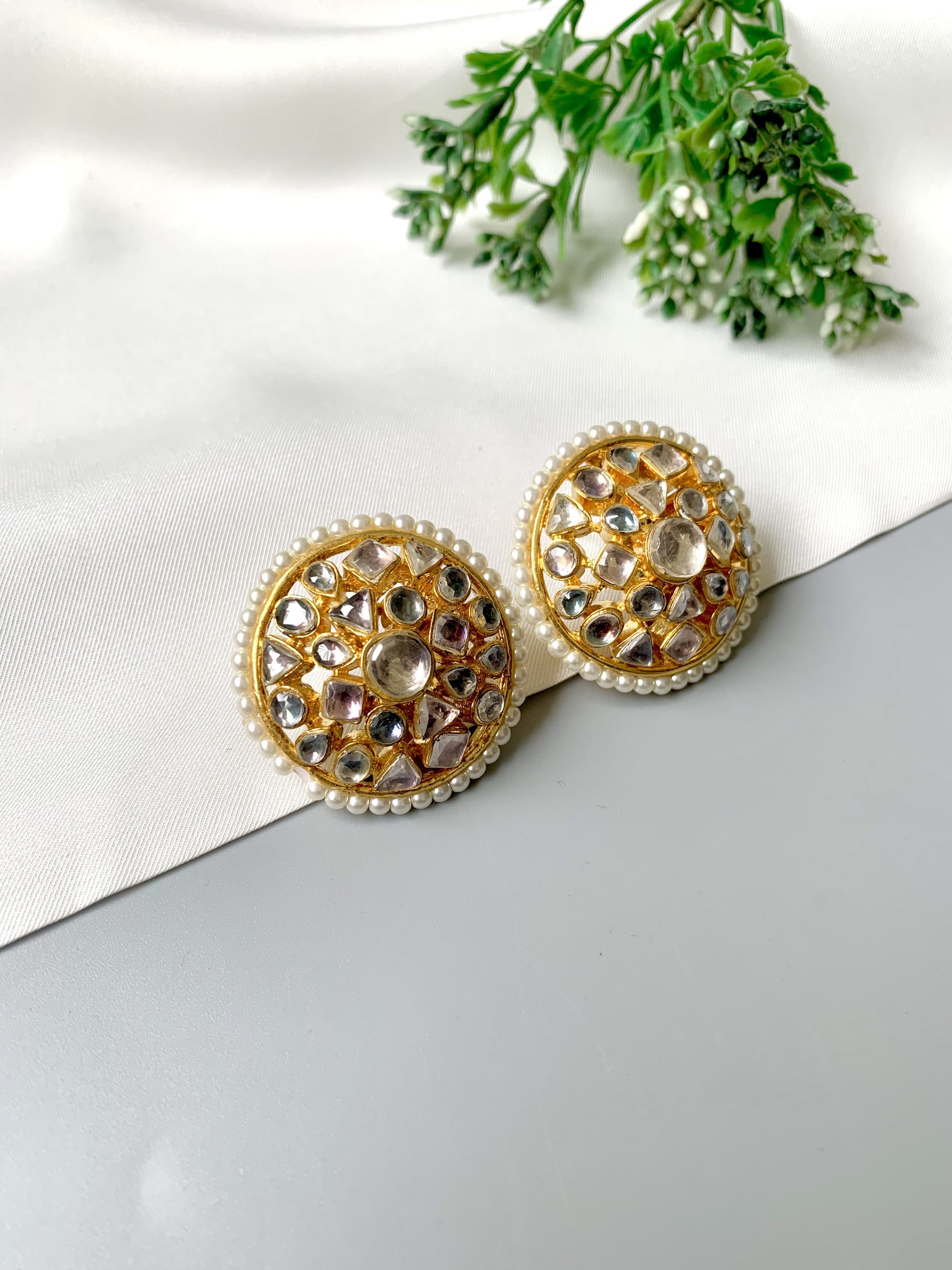 Traditional Pachi Kundan and pearl stud earrings angled side view