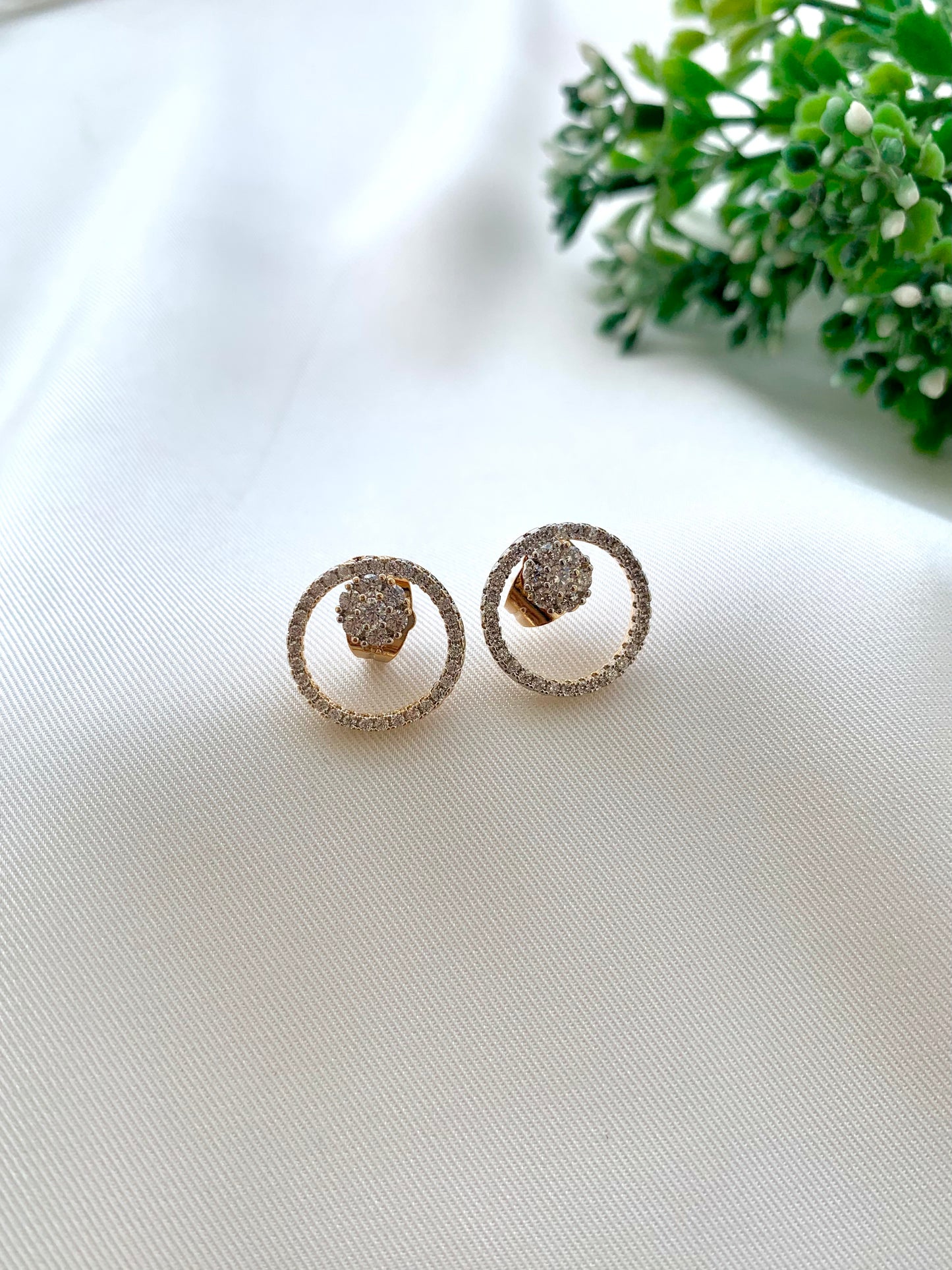 Mina gold plated studs in diamond finish with American diamonds