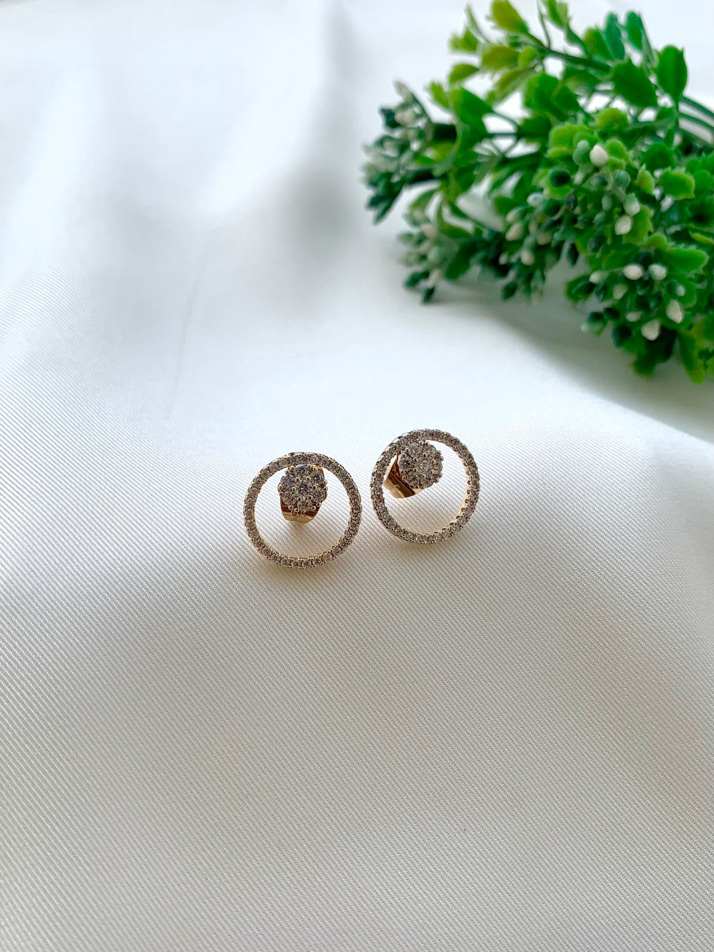 Mina gold plated studs in diamond finish with American diamonds