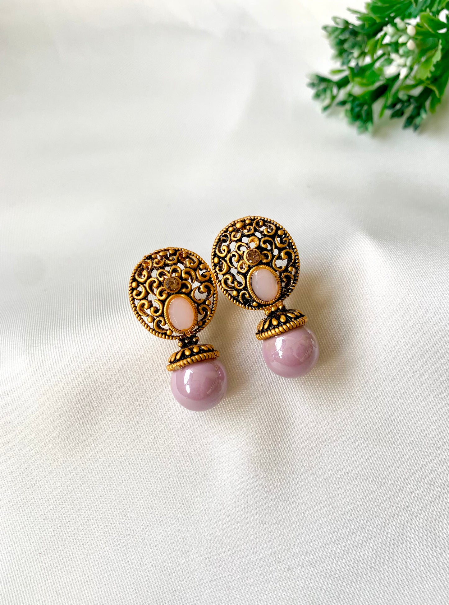 Hand crafted Mira Pink earrings in 22kt gold plating with reverse American diamonds and semi-precious Onyx stones