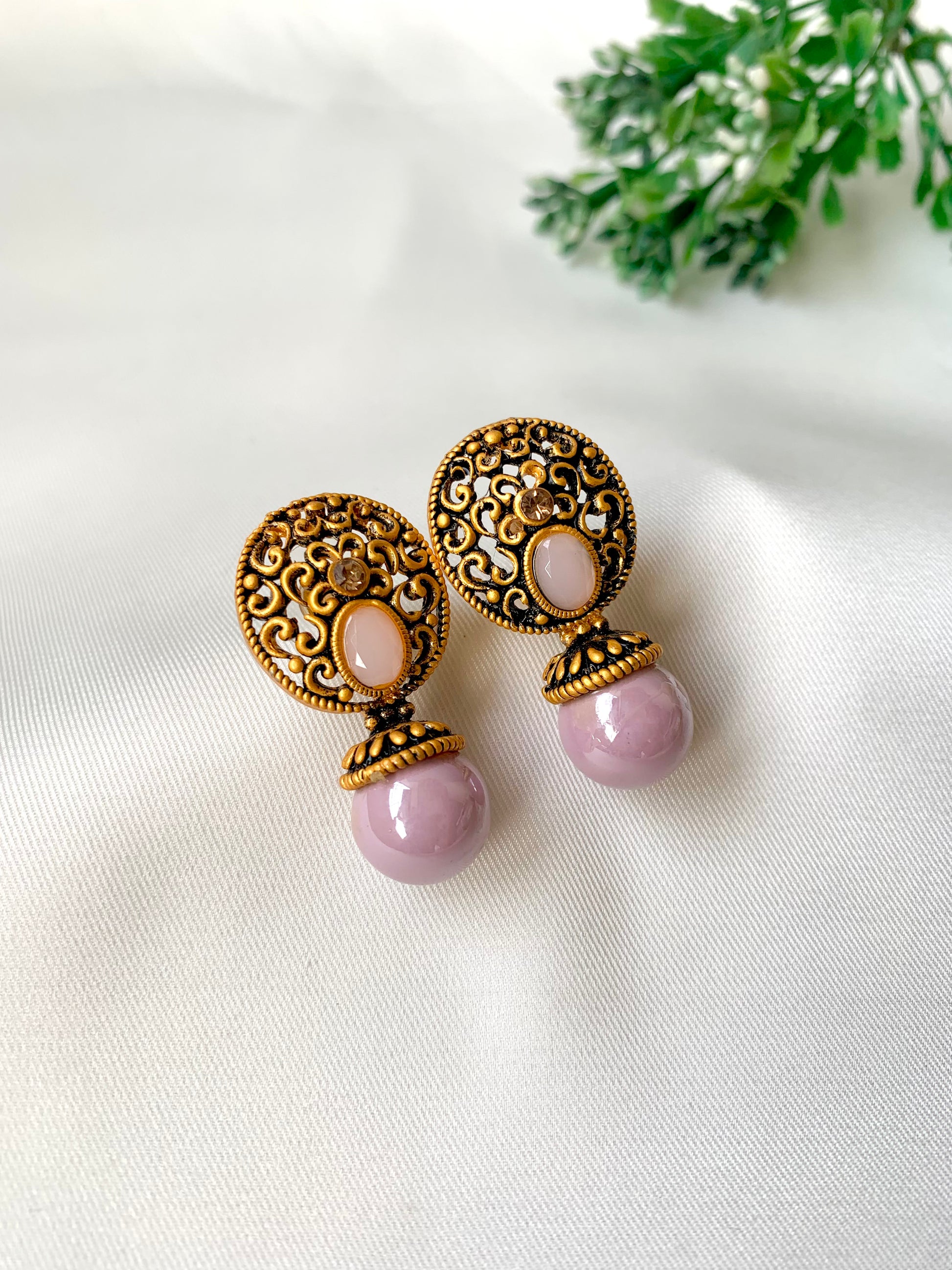 Hand crafted Mira Pink earrings in 22kt gold plating with reverse American diamonds and semi-precious Onyx stones