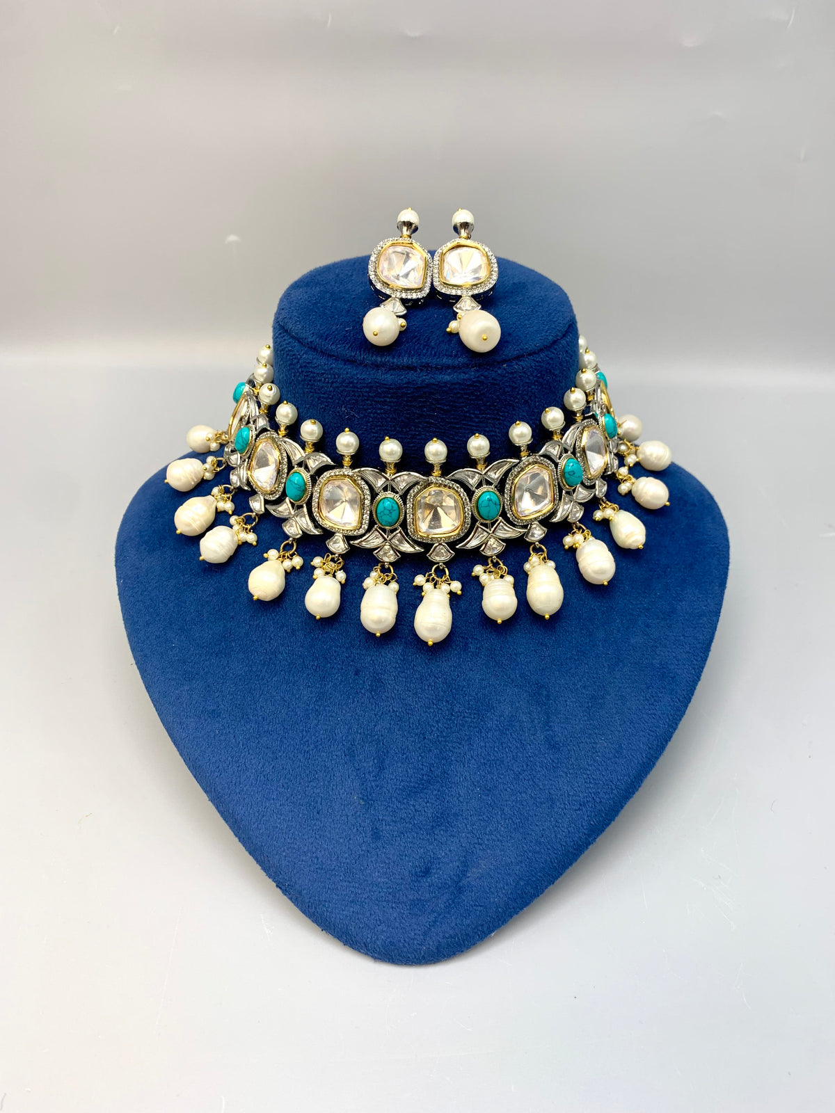 Rhodium plated handcrafted choker set with American diamonds, baroque pearls, polki kundan and feroza stones