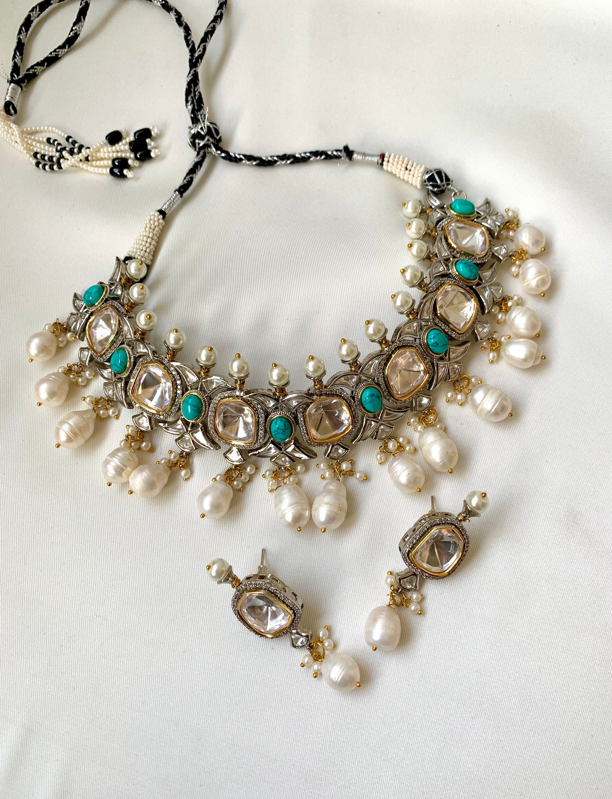 Rhodium plated handcrafted choker set with American diamonds, baroque pearls, polki kundan and feroza stones