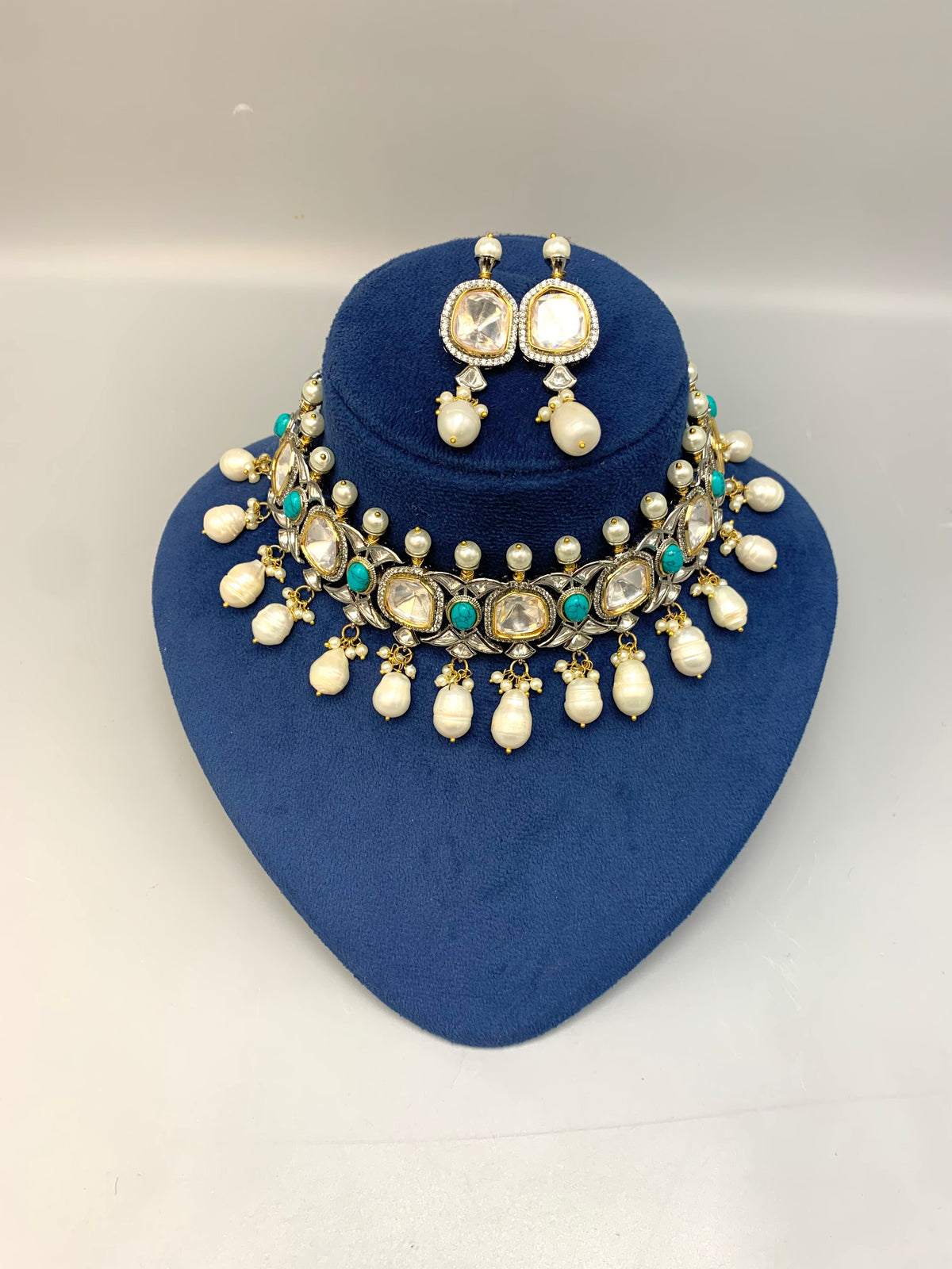 Rhodium plated handcrafted choker set with American diamonds, baroque pearls, polki kundan and feroza stones