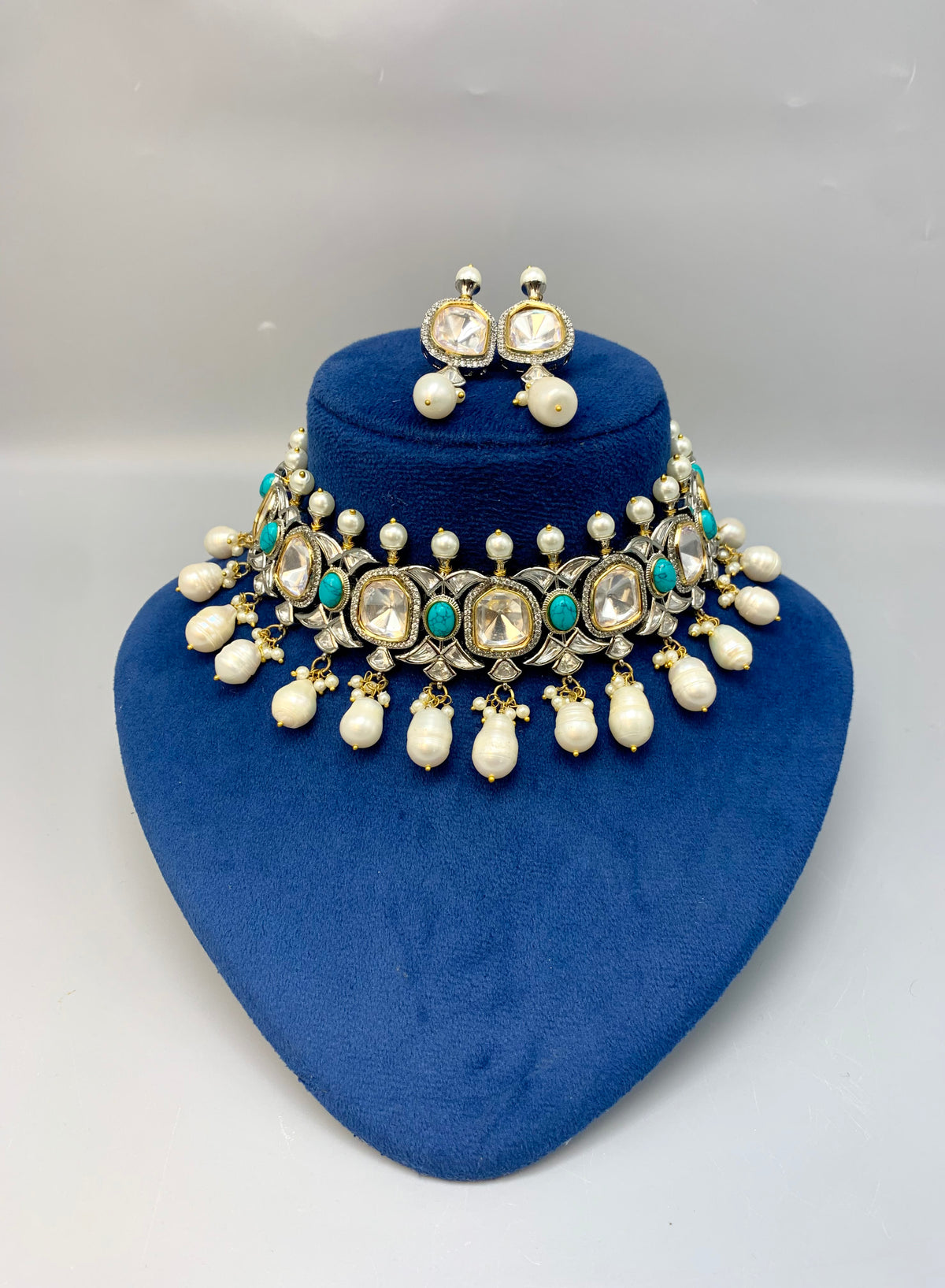Rhodium plated handcrafted choker set with American diamonds, baroque pearls, polki kundan and feroza stones