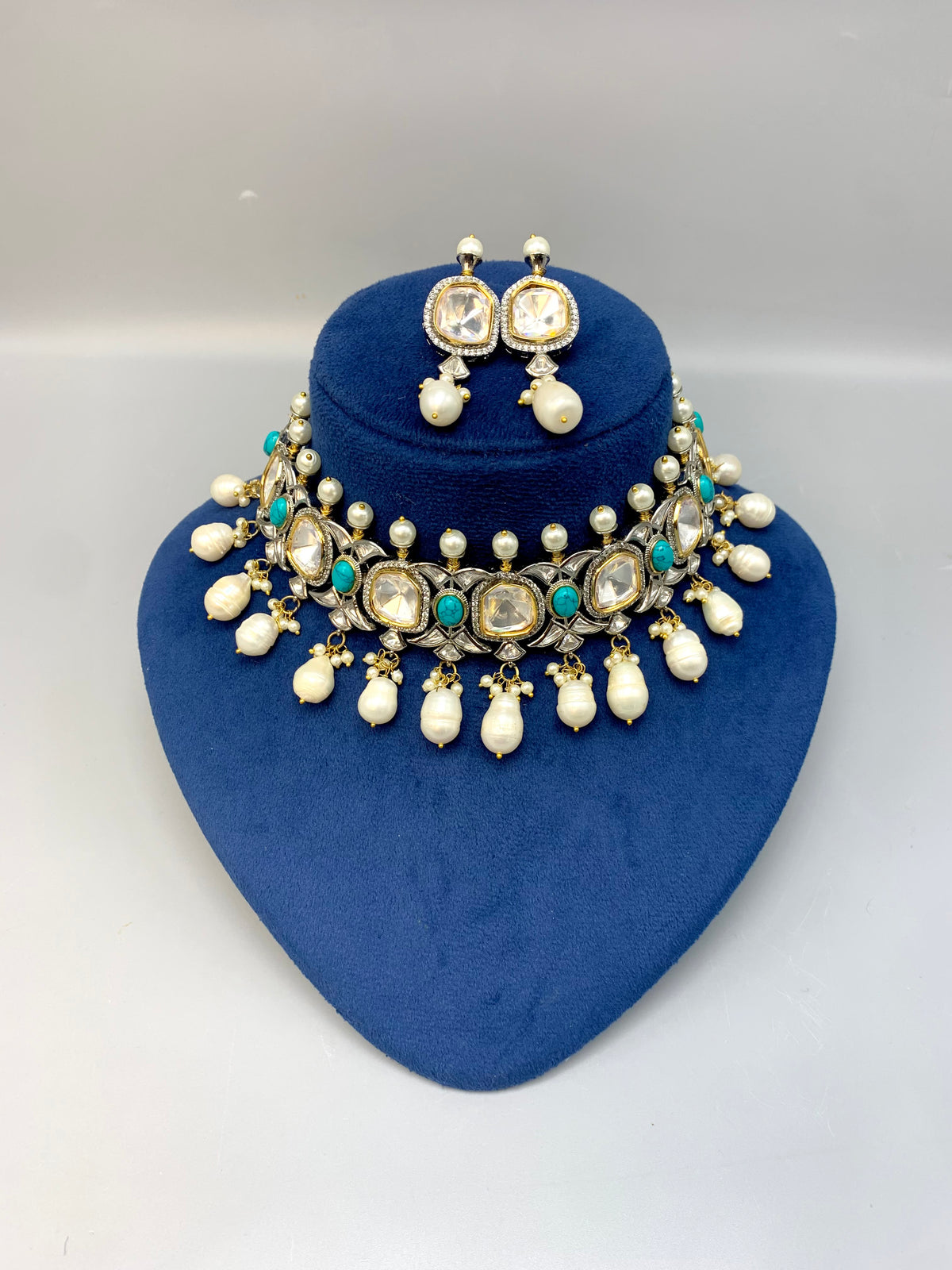 Rhodium plated handcrafted choker set with American diamonds, baroque pearls, polki kundan and feroza stones
