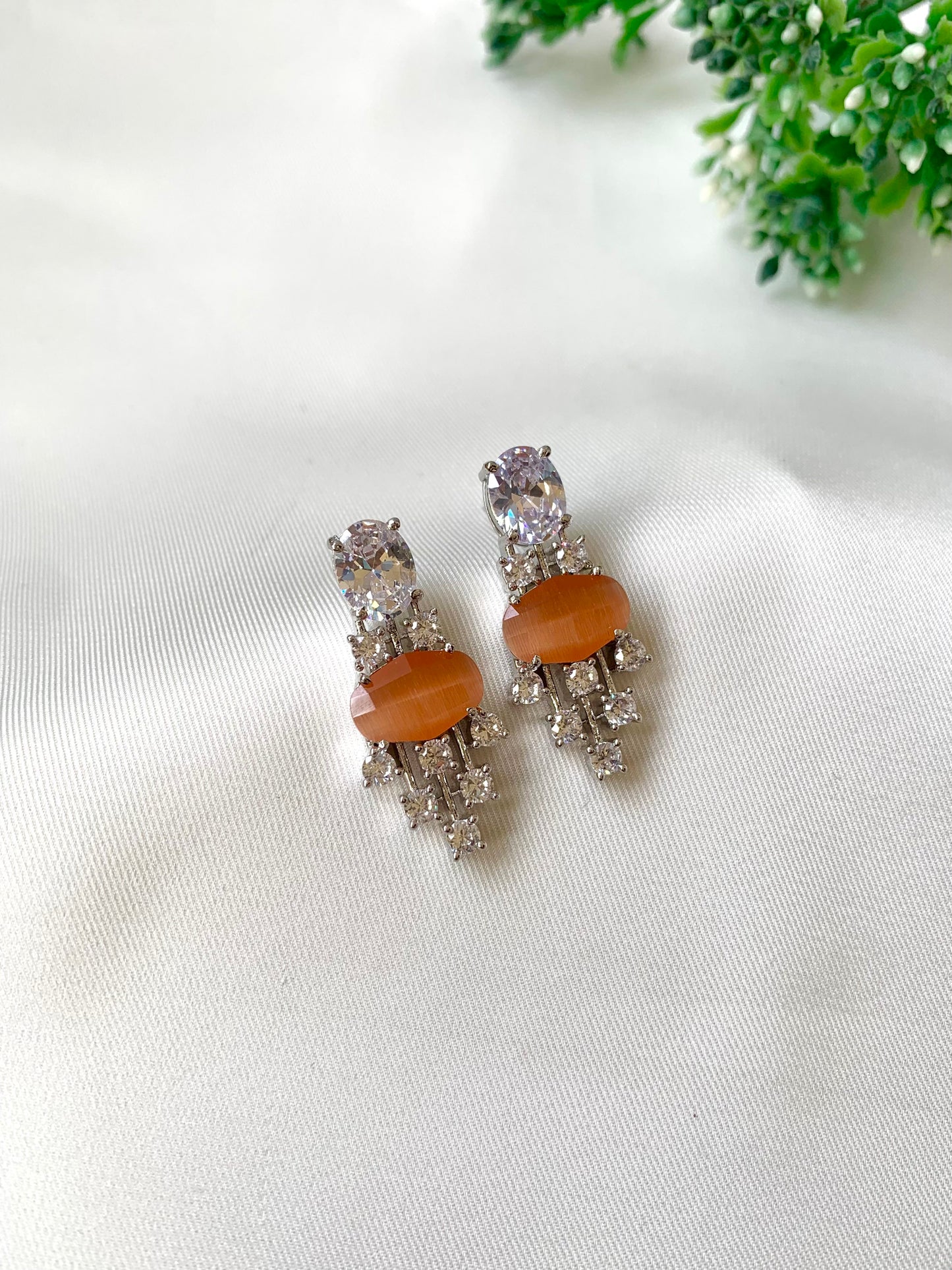 Hand crafted Miri orange earrings in rhodium plating with American Diamonds and semi-precious onyx