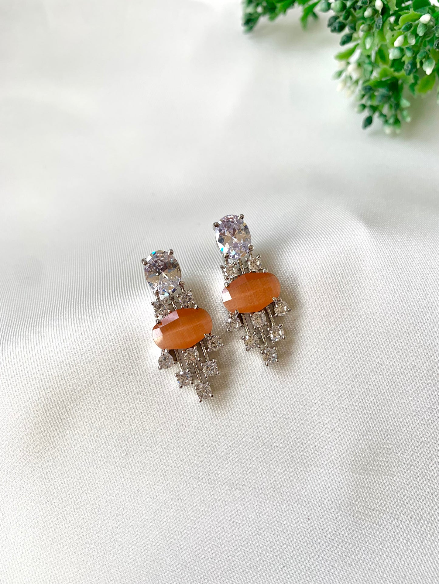 Hand crafted Miri orange earrings in rhodium plating with American Diamonds and semi-precious onyx