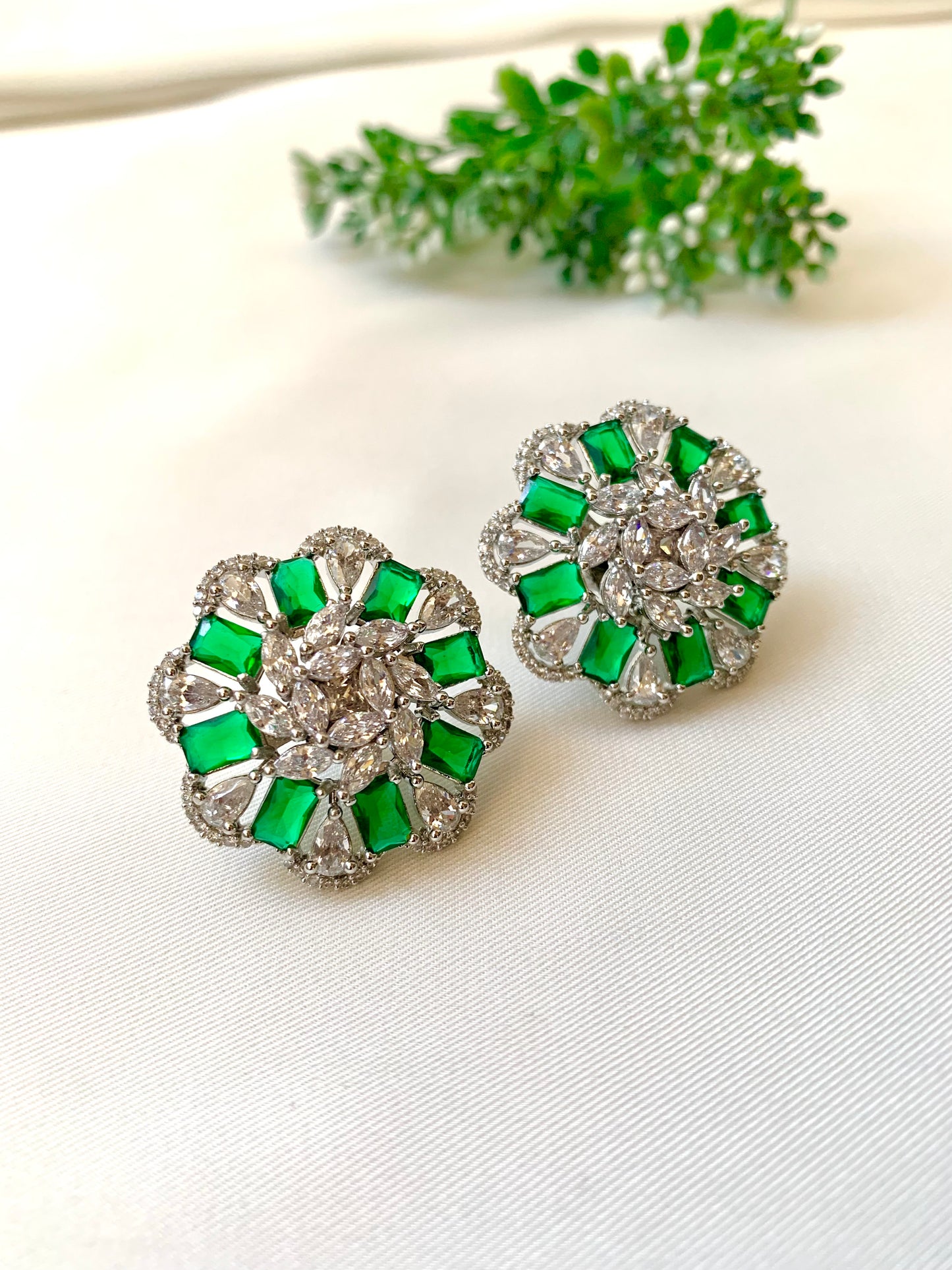 Moa emerald designer studs in rhodium plating with american diamonds
