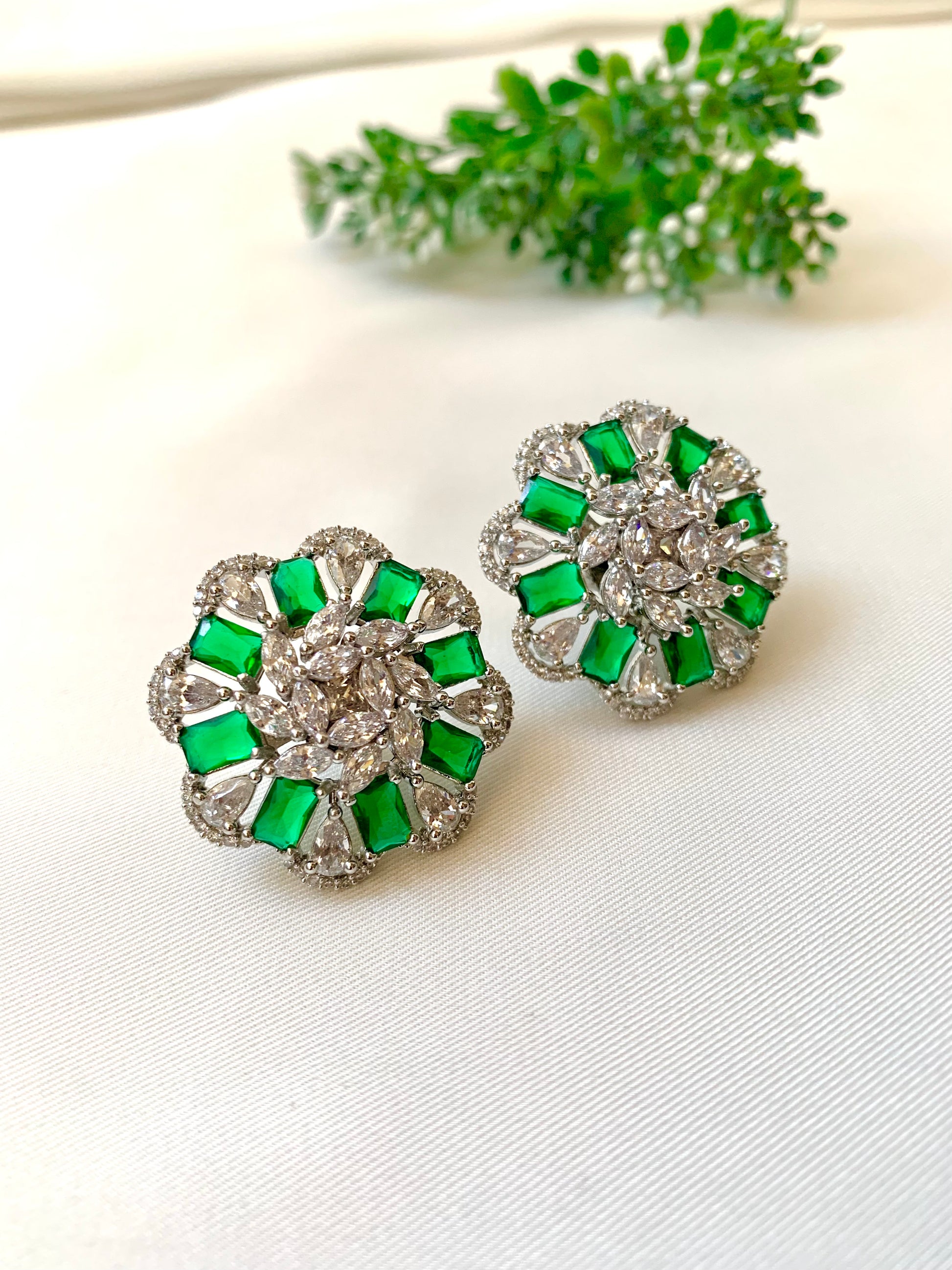 Moa emerald designer studs in rhodium plating with american diamonds