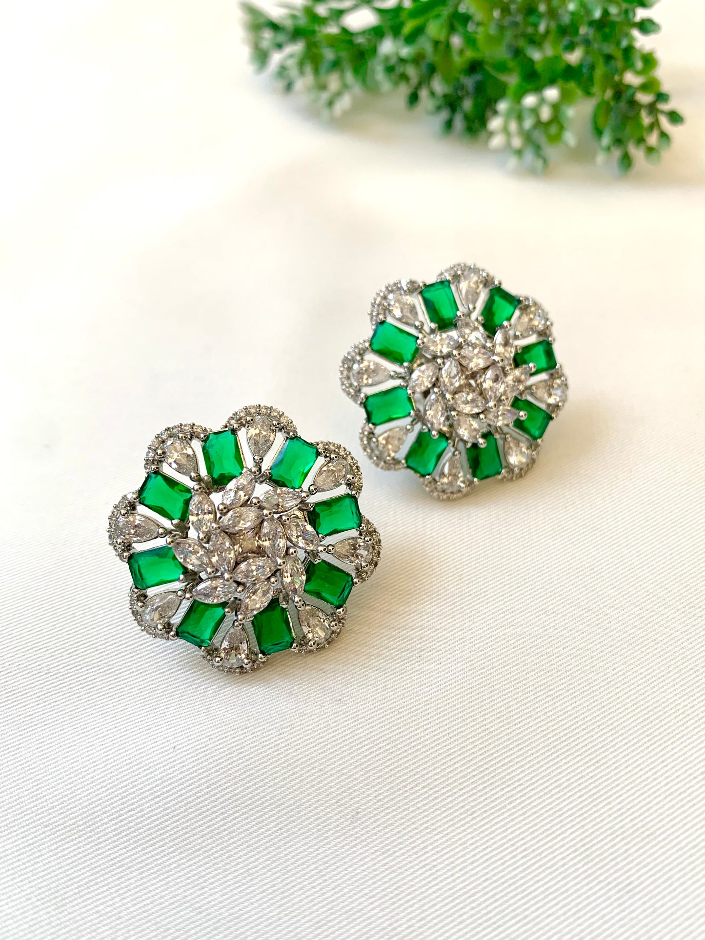 Moa emerald designer studs in rhodium plating with american diamonds