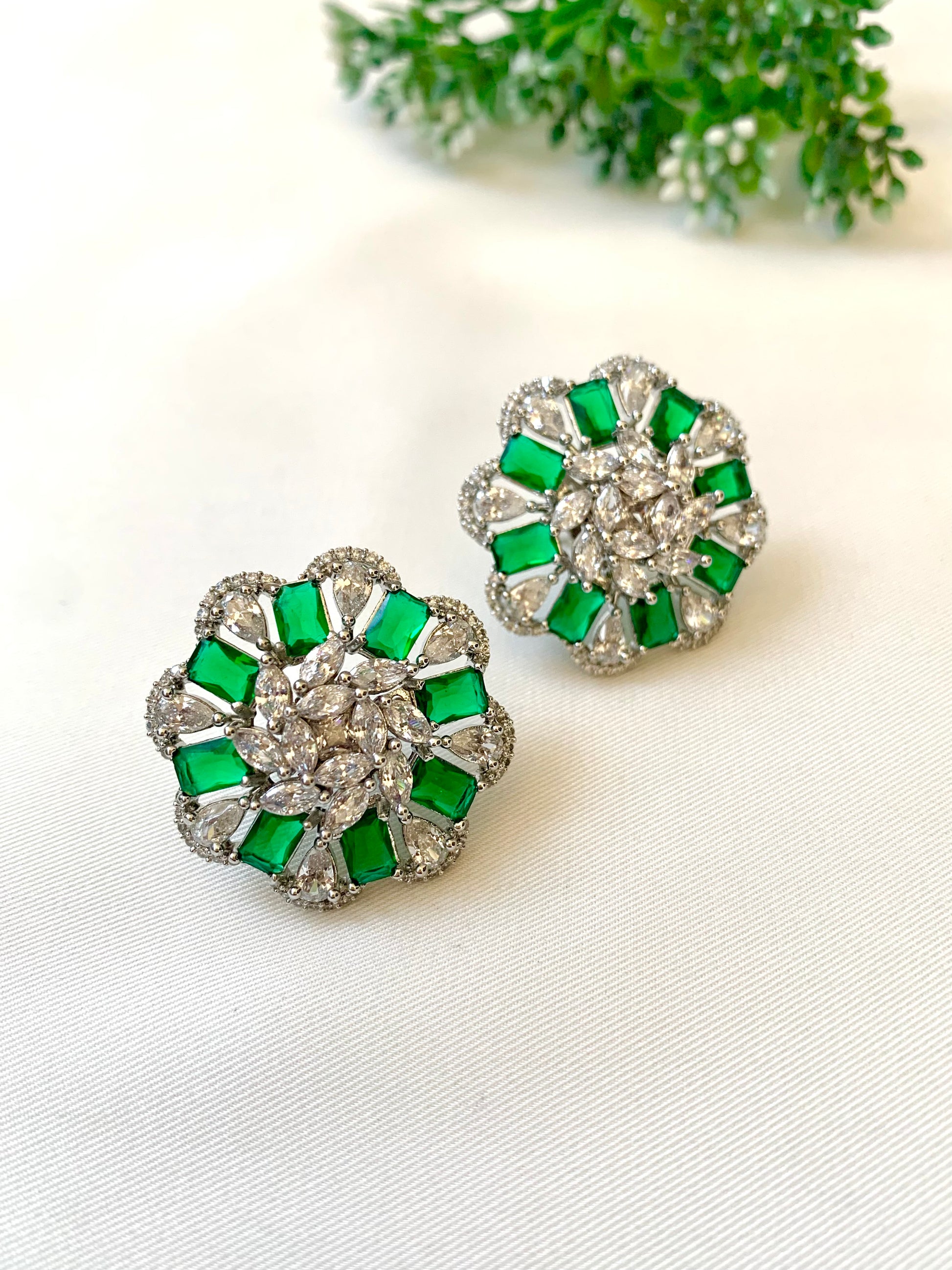 Moa emerald designer studs in rhodium plating with american diamonds