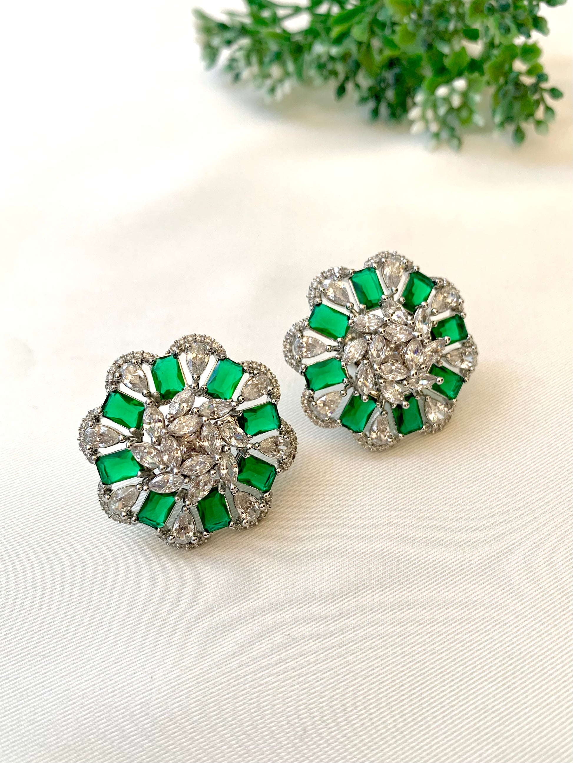 Moa emerald designer studs in rhodium plating with american diamonds