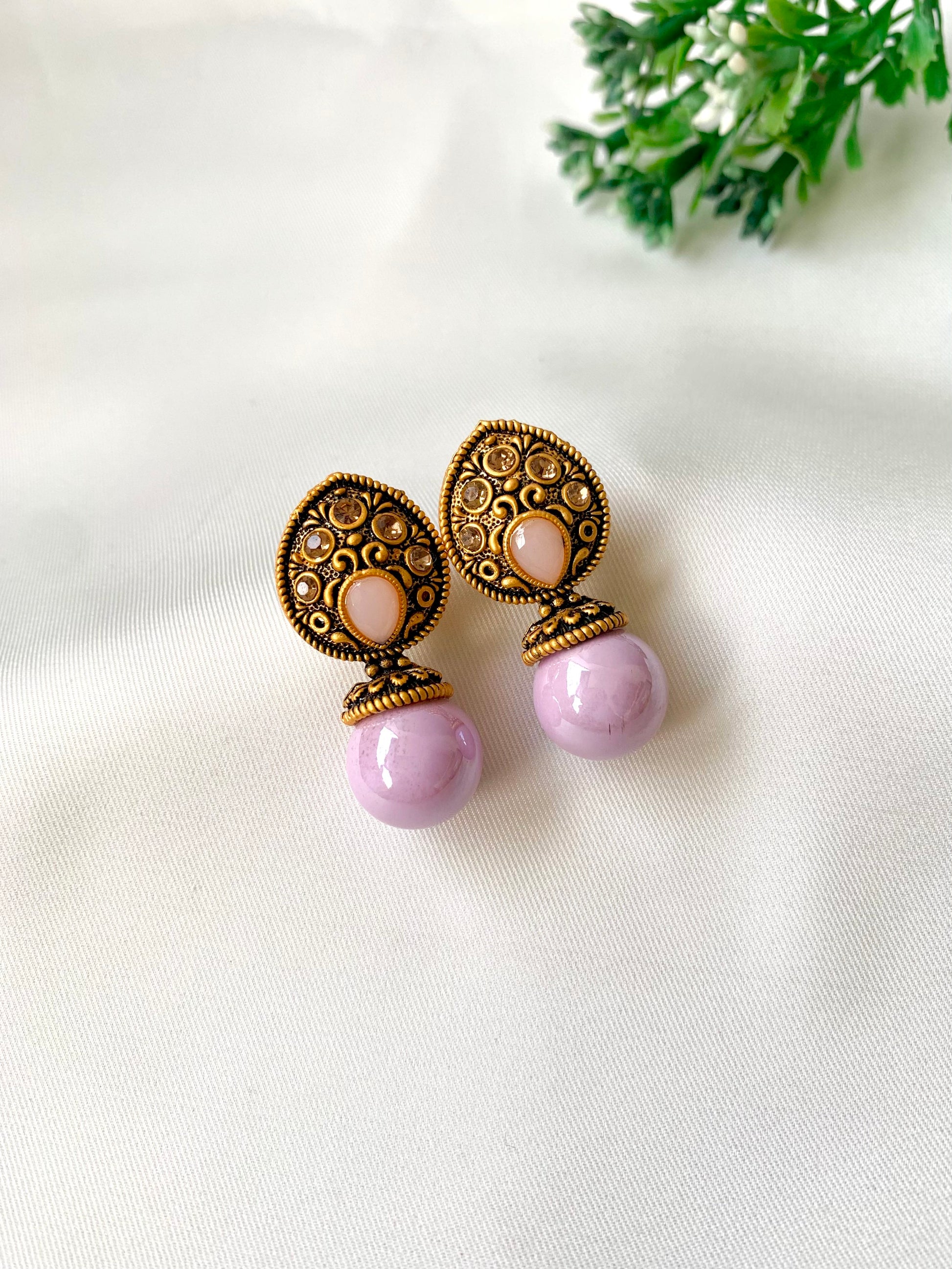 Hand crafted Mira Pink earrings in 22kt gold plating with reverse American diamonds and semi-precious Onyx stones