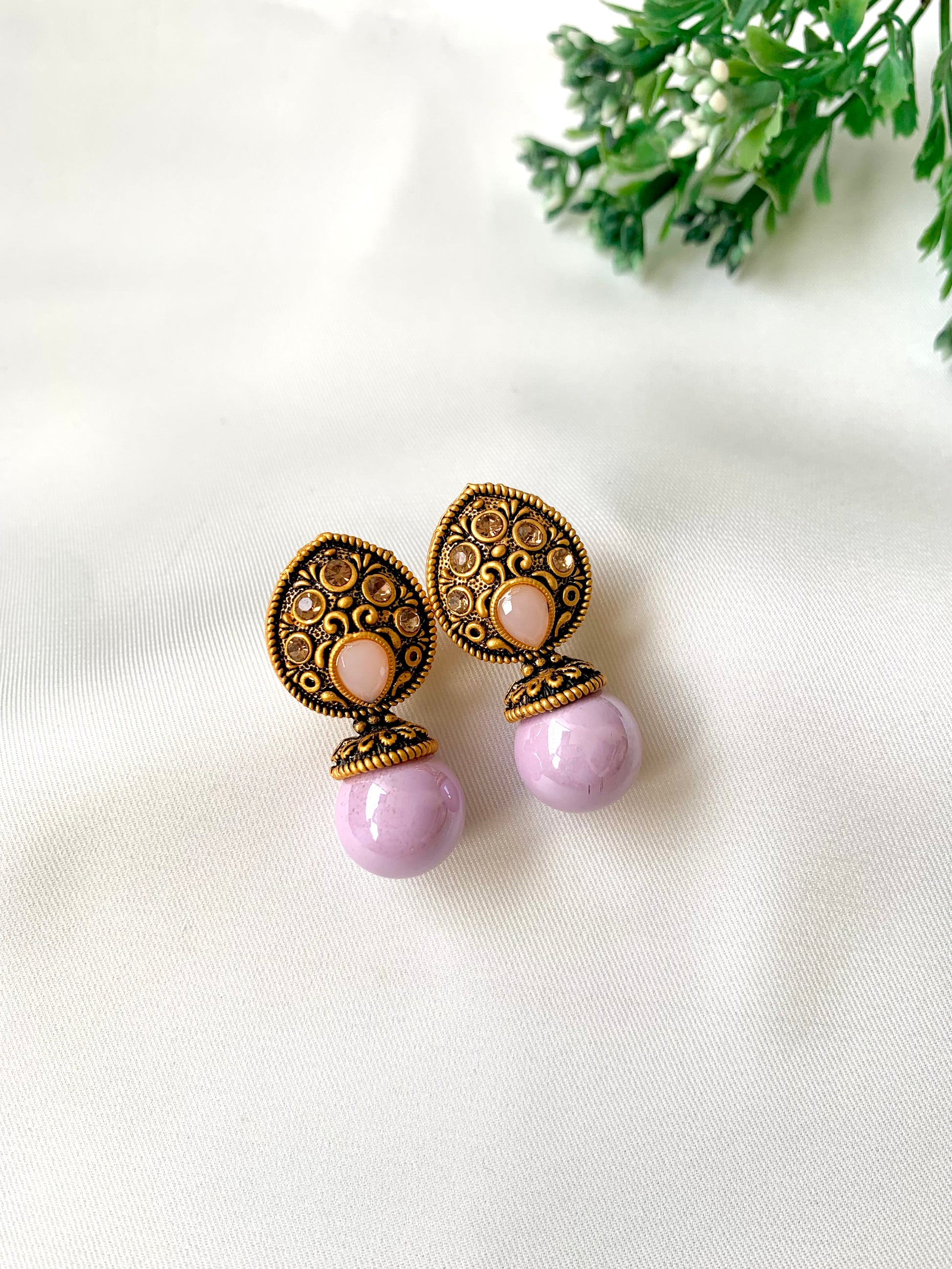 Hand crafted Mira Pink earrings in 22kt gold plating with reverse American diamonds and semi-precious Onyx stones