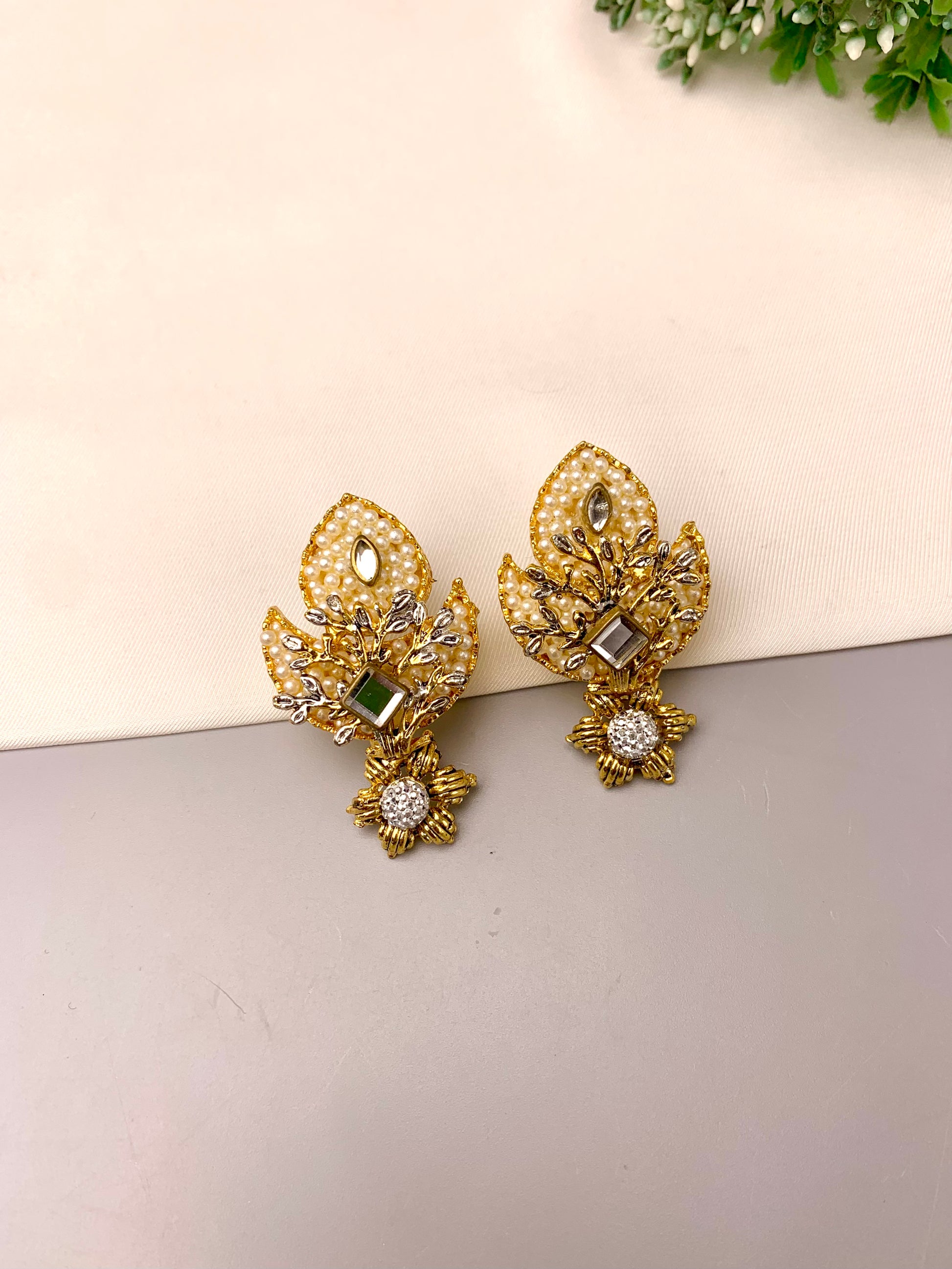 Naghma handcrafted 22kt gold plated earrings featuring American Diamonds, Kundan and semi-precious Pearls