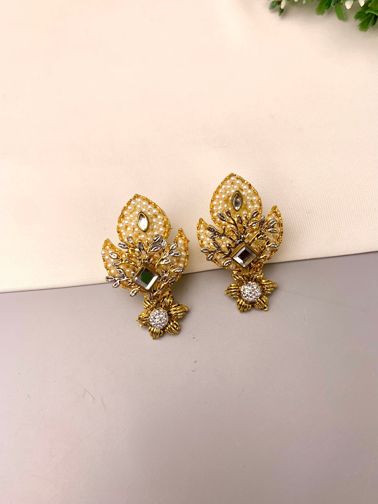 Naghma handcrafted 22kt gold plated earrings featuring American Diamonds, Kundan and semi-precious Pearls