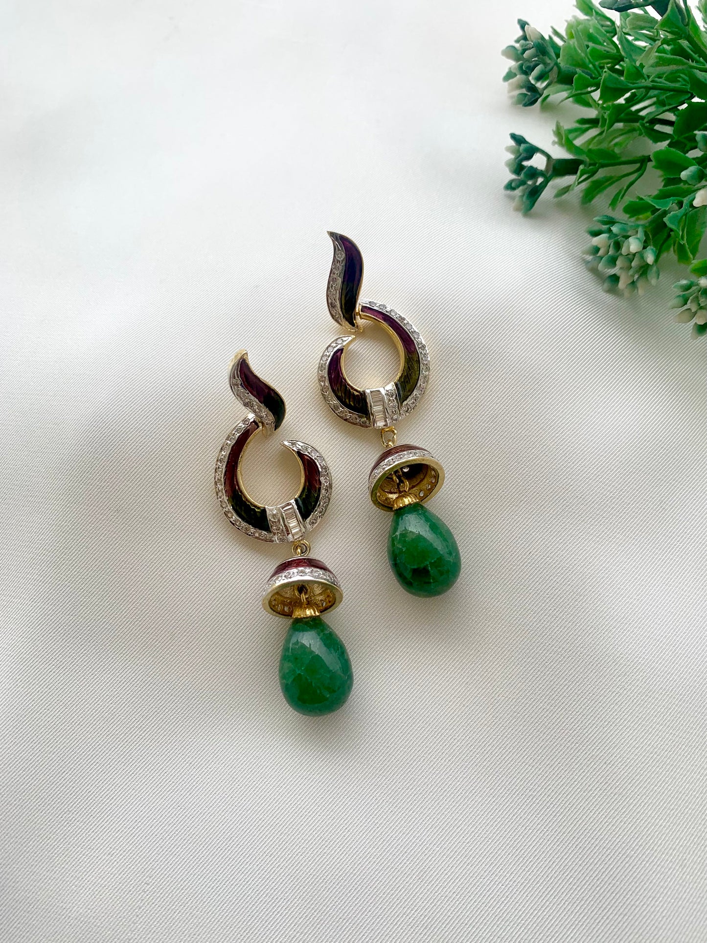 Neelam handcrafted 22kt gold plated earrings with American Diamonds, semi-precious Emeralds and hand-painted Meena