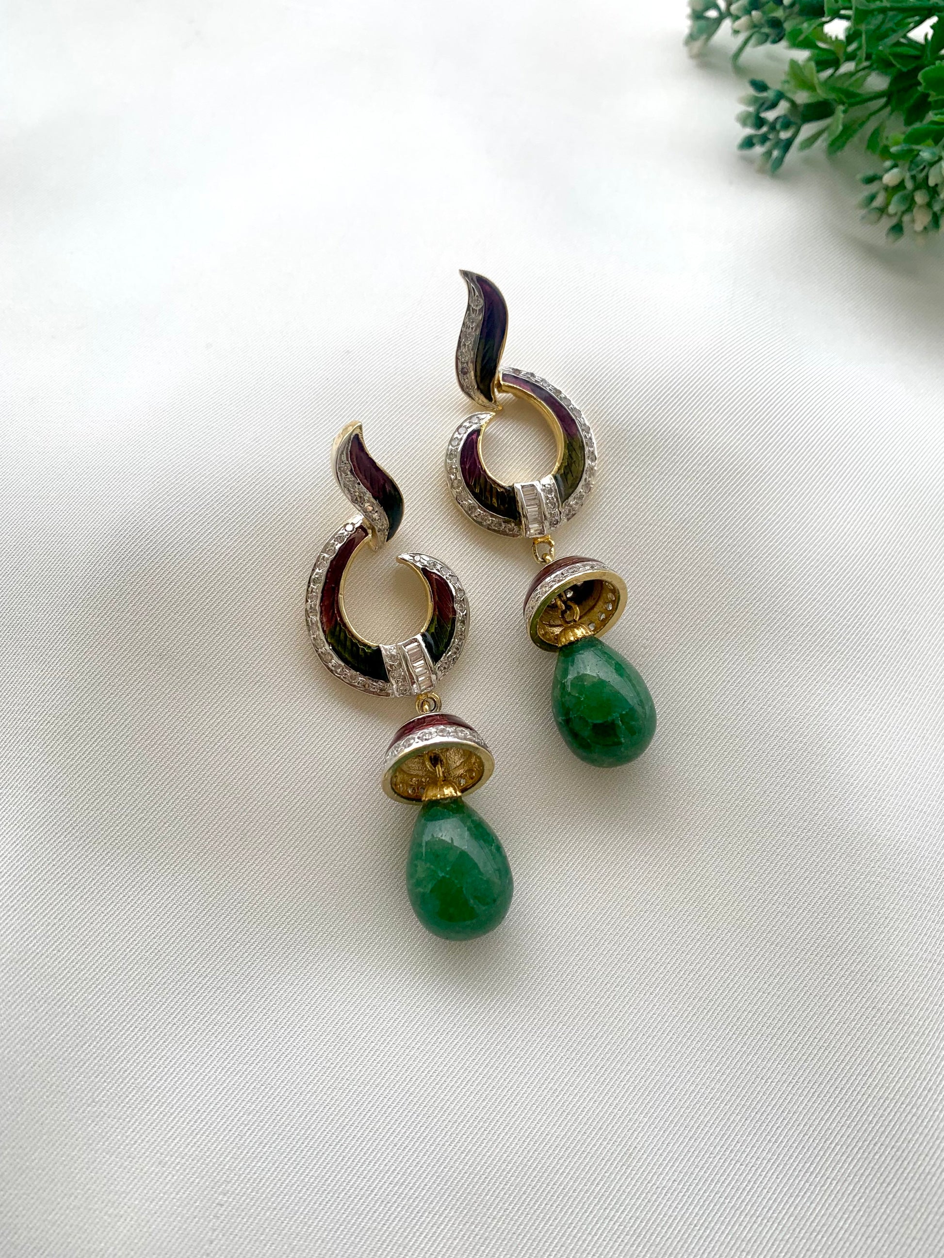 Neelam handcrafted 22kt gold plated earrings with American Diamonds, semi-precious Emeralds and hand-painted Meena