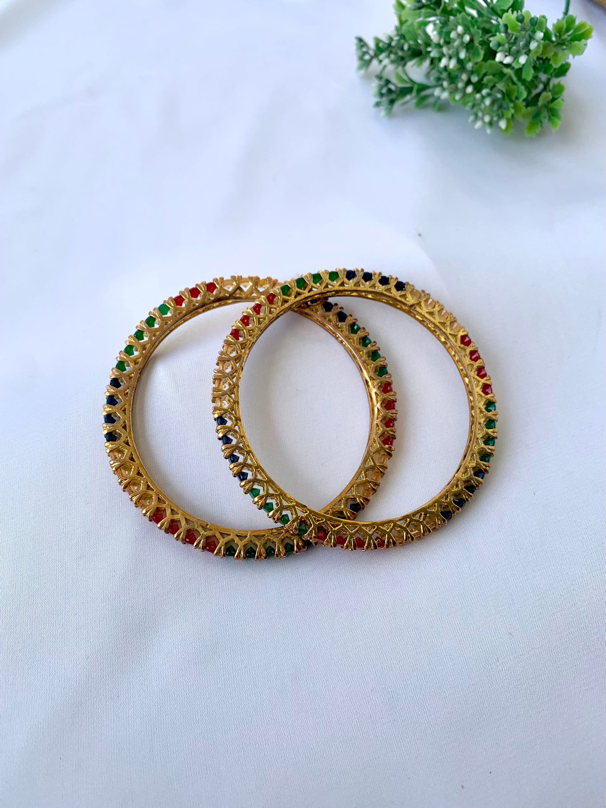 Handcrafted Neriah Bangles in 22kt gold plating with reverse Semi-Precious Ruby, Emerald, Sapphire, and Champagne stones