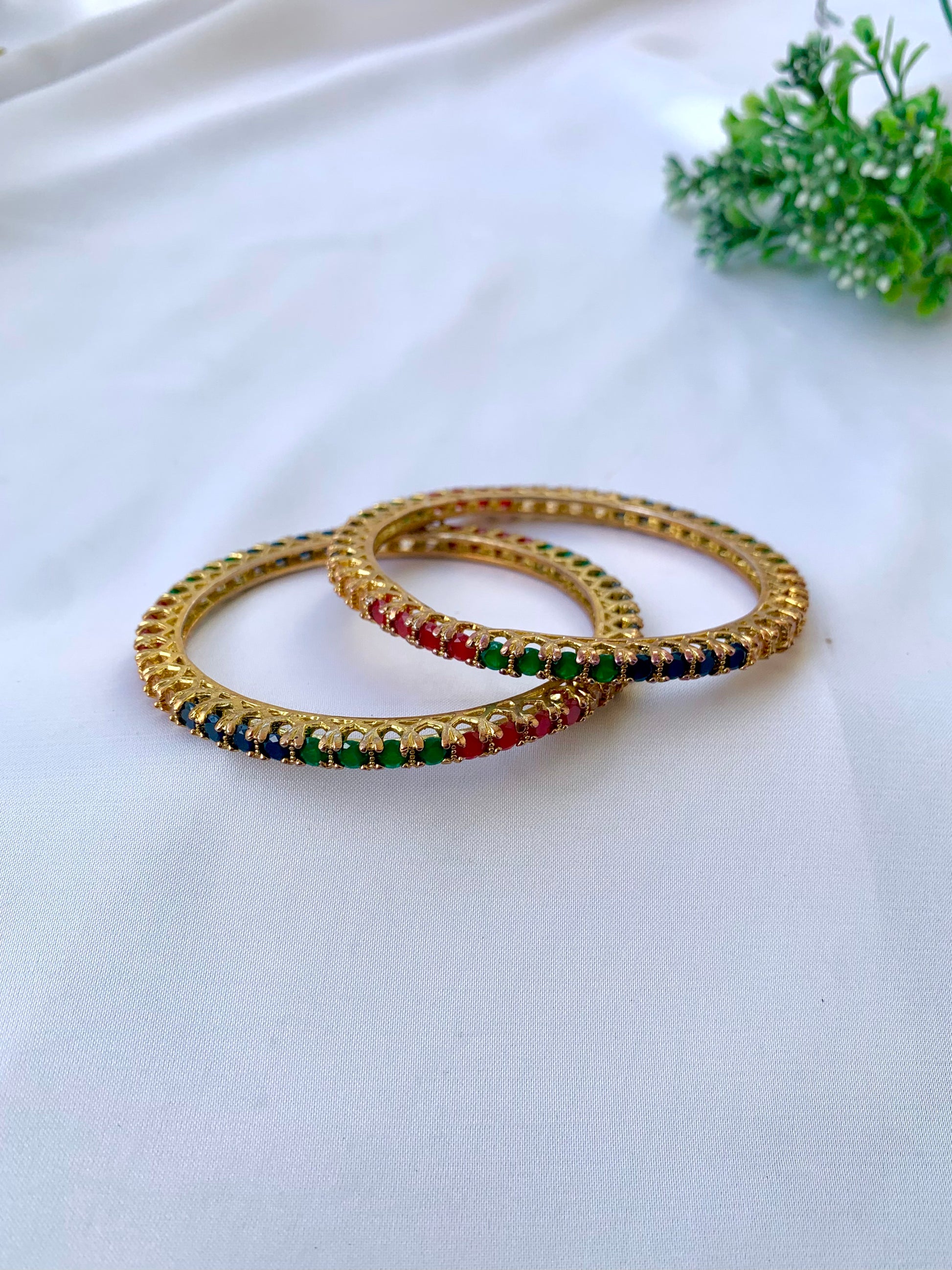 Handcrafted Neriah Bangles in 22kt gold plating with reverse Semi-Precious Ruby, Emerald, Sapphire, and Champagne stones