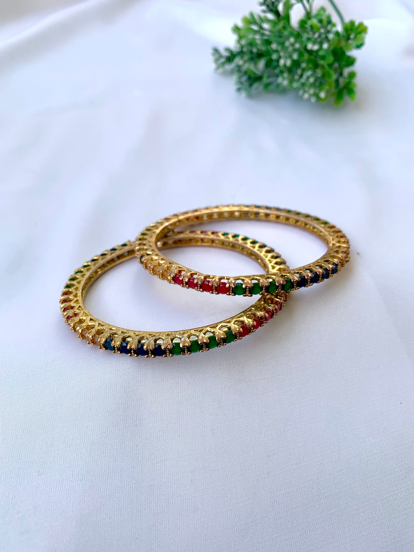 Handcrafted Neriah Bangles in 22kt gold plating with reverse Semi-Precious Ruby, Emerald, Sapphire, and Champagne stones