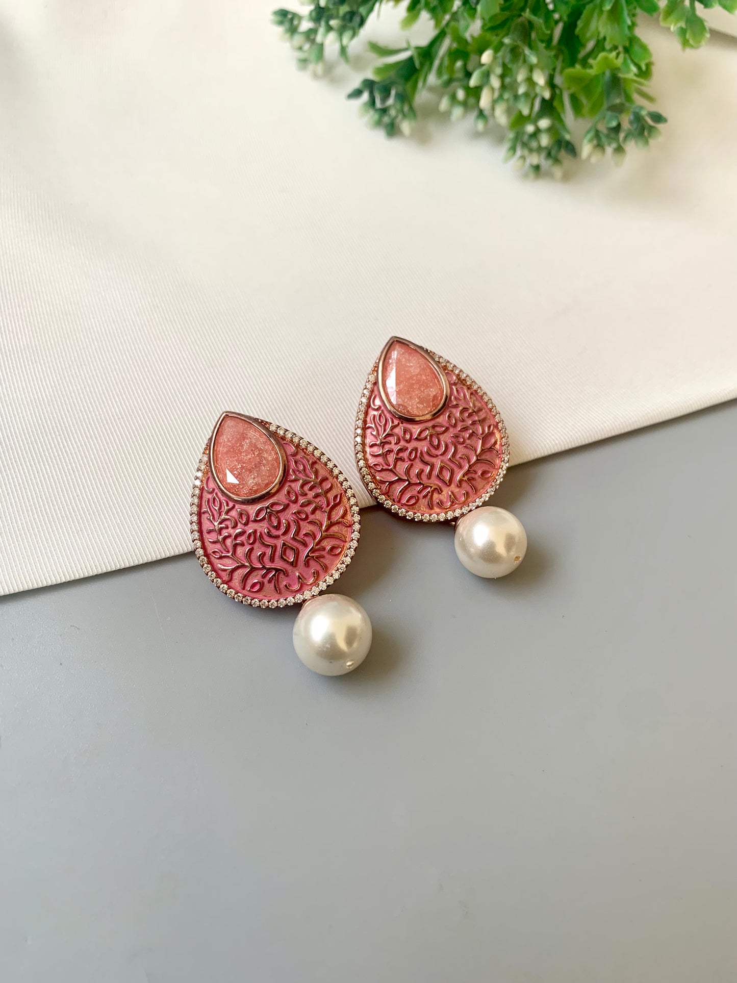 Hand crafted Noori earrings in 22kt gold plating with American Diamonds, milky stones, pearls and hand-painted meena