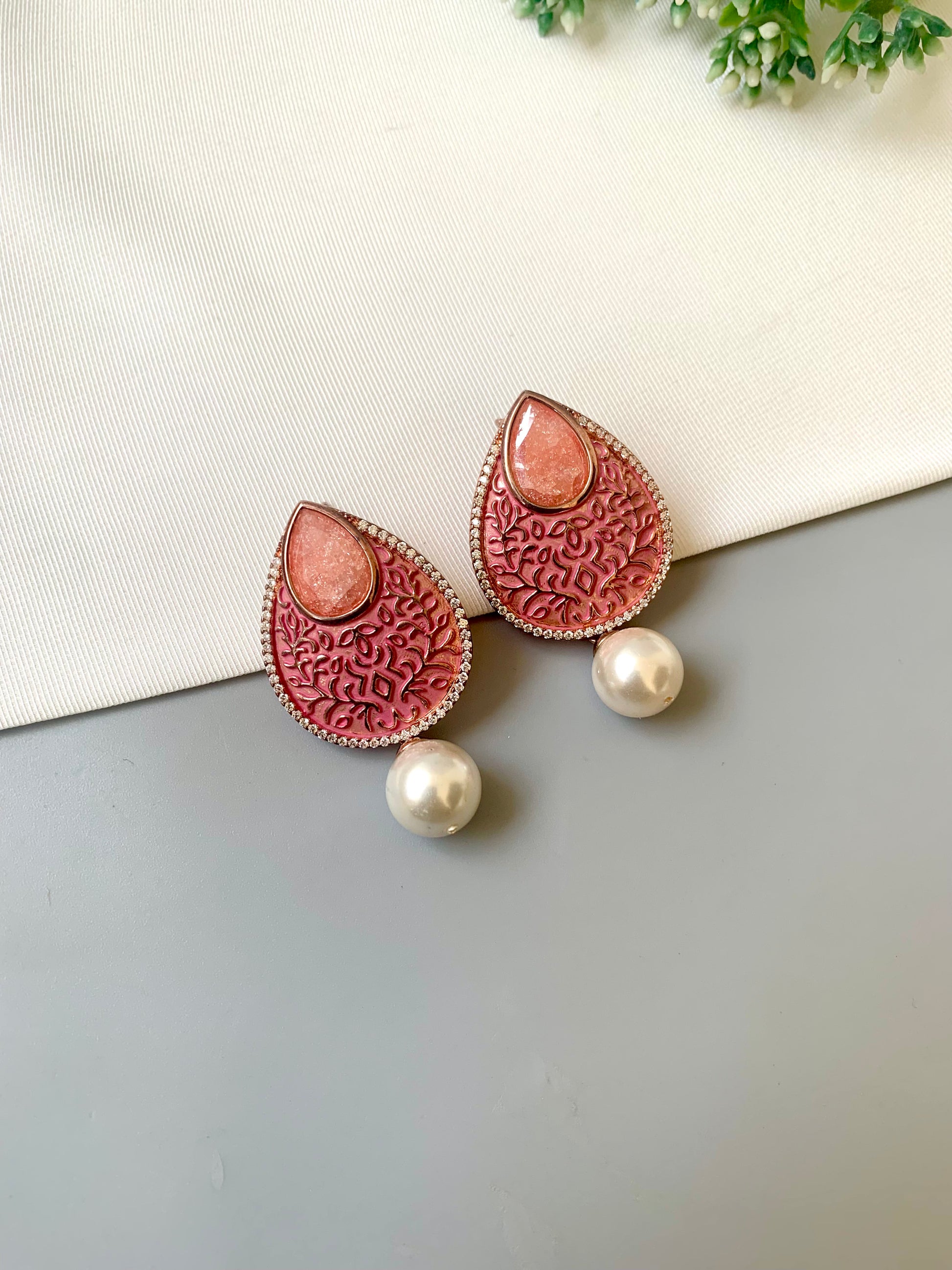 Hand crafted Noori earrings in 22kt gold plating with American Diamonds, milky stones, pearls and hand-painted meena