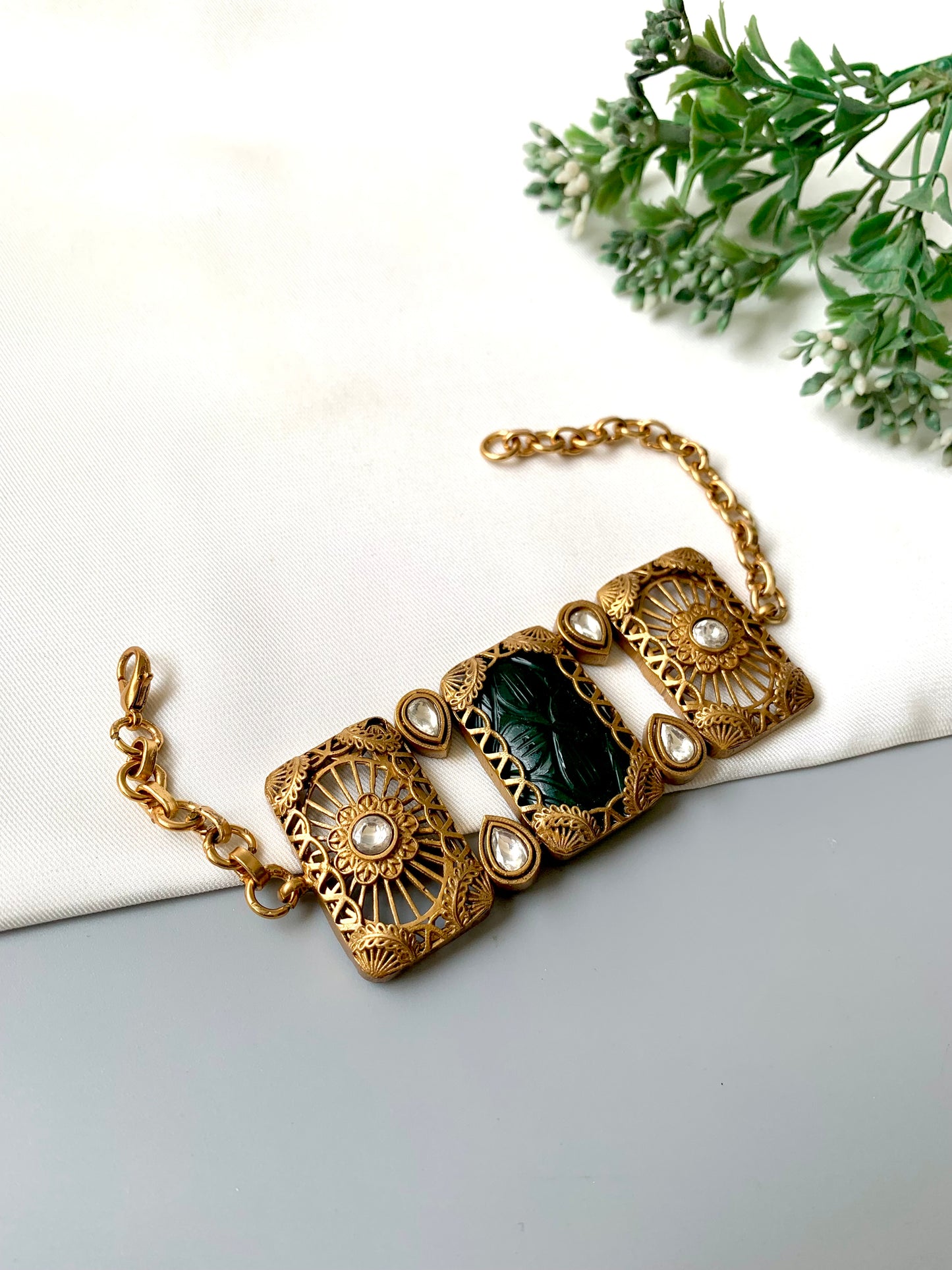 Parishay emerald kundan bracelet in victorian rose gold plating with hand carved gemstone