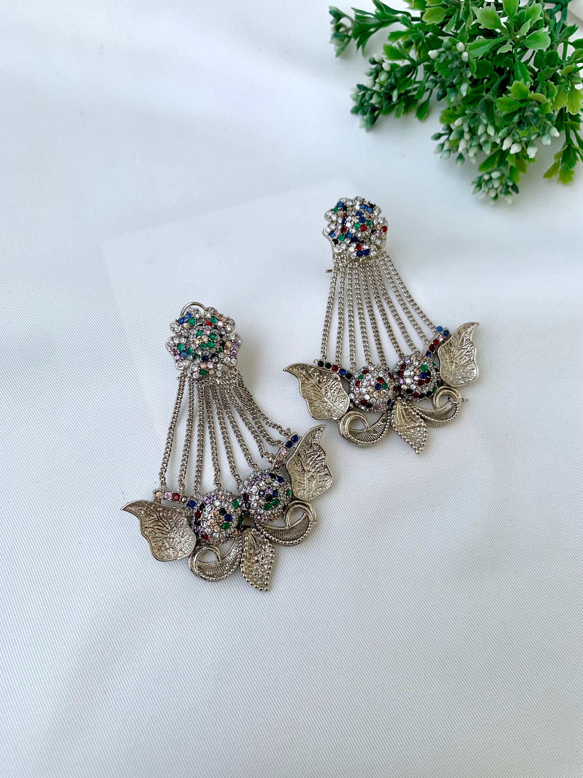 Parvati multi jhoomar earrings in rhodium plating with American diamonds and gemstone detailing