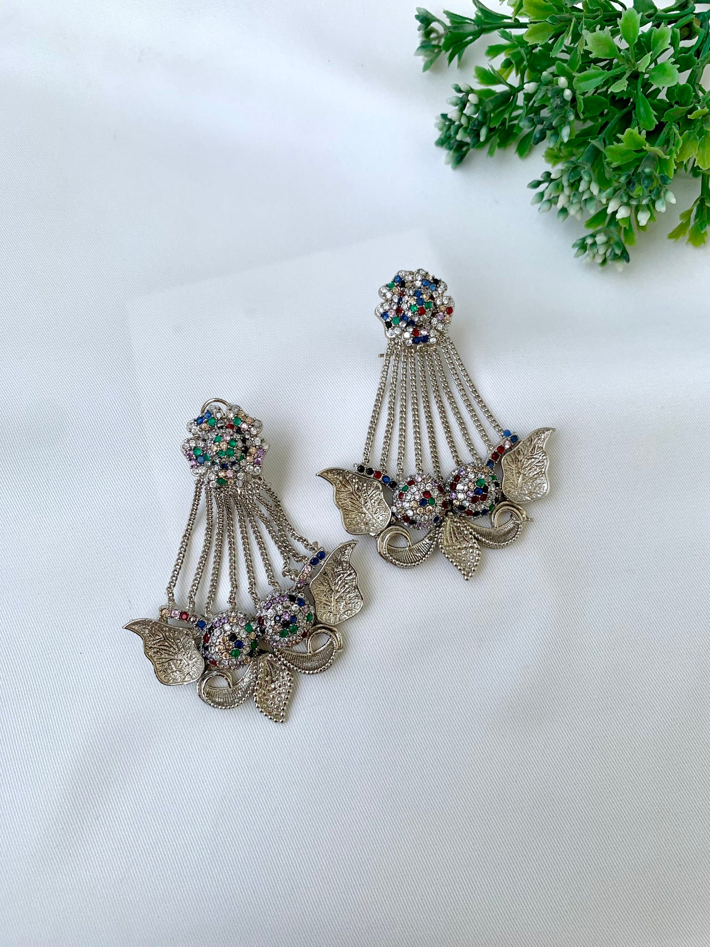Parvati multi jhoomar earrings in rhodium plating with American diamonds and gemstone detailing