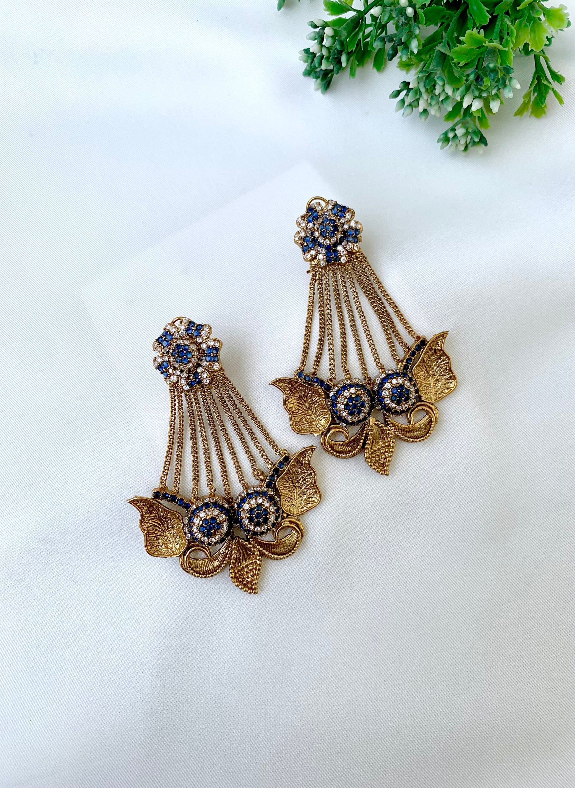 Parvati sapphire jhoomar earrings in gold plating with American diamonds and gemstone detailing