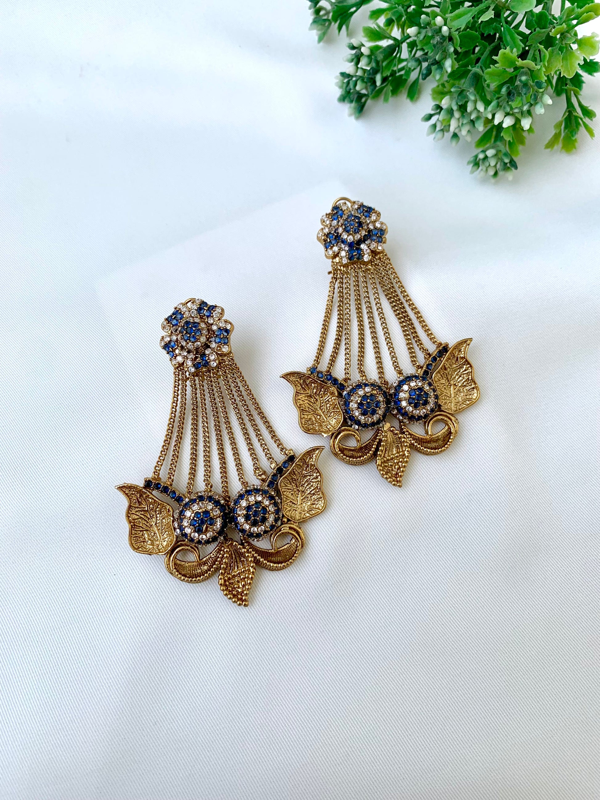 Parvati sapphire jhoomar earrings in gold plating with American diamonds and gemstone detailing