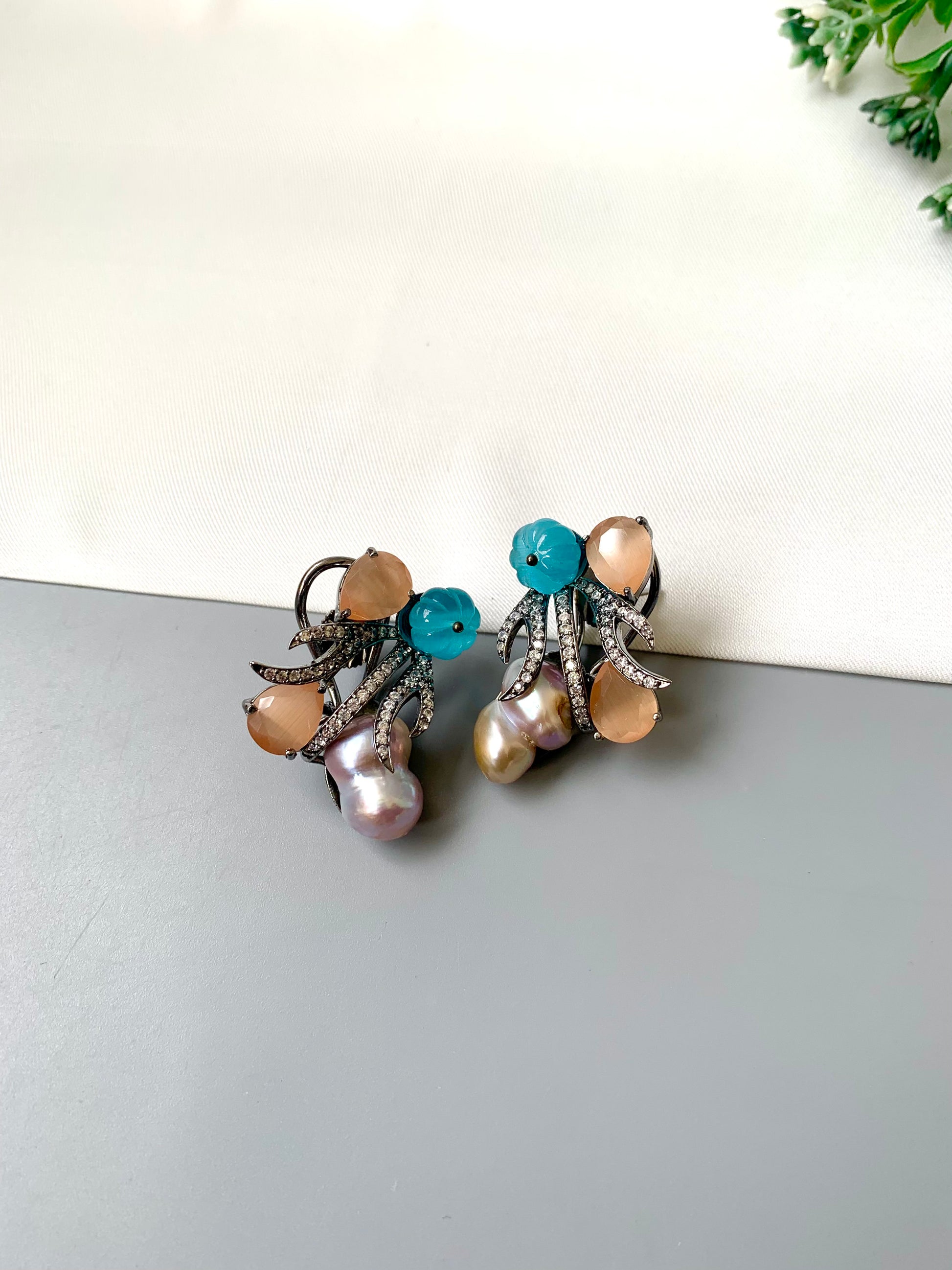 Petra orange onyx baroque pearl studs in rhodium oxidized finish with melon beads and American diamonds