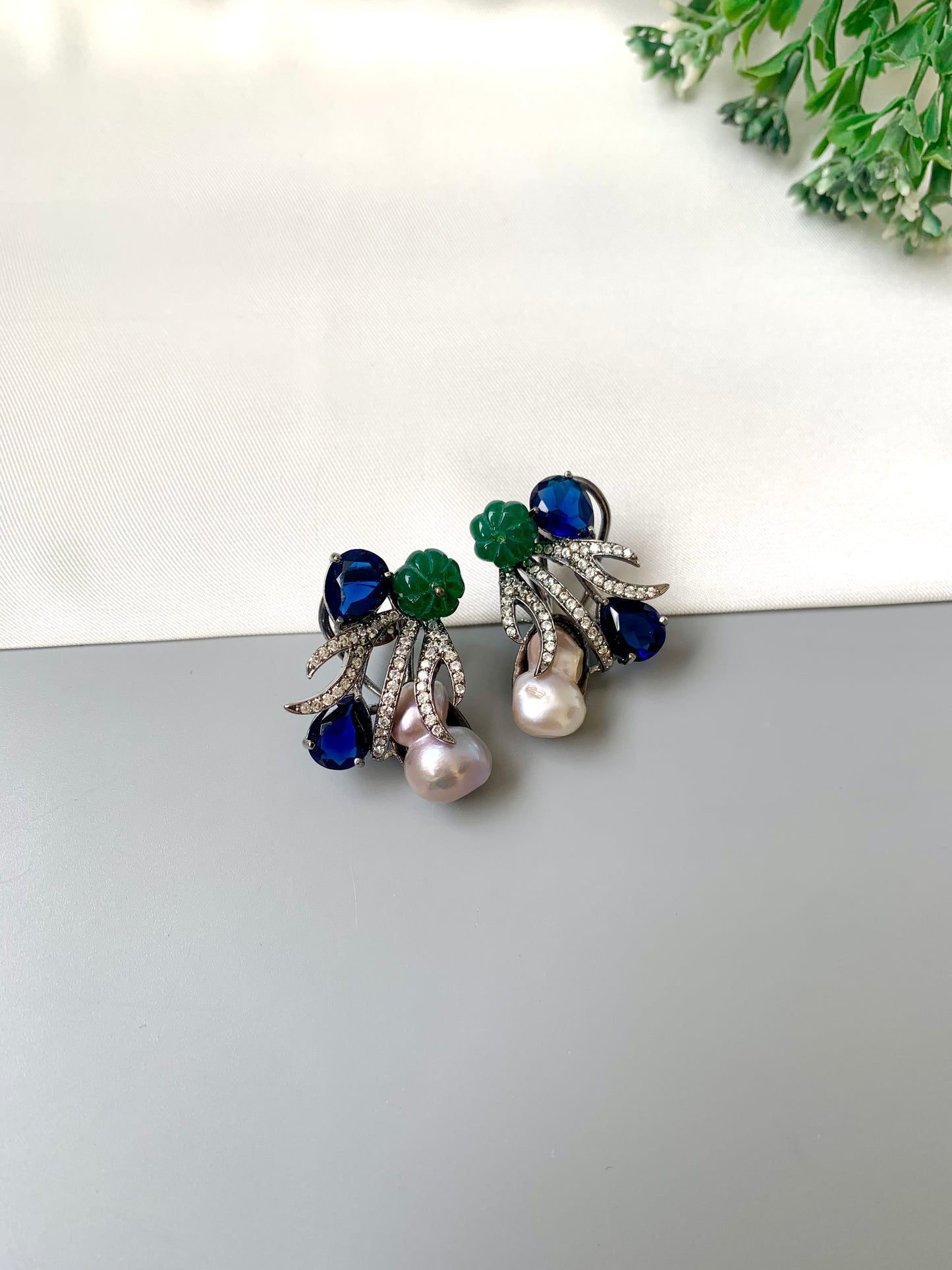 Petra sapphire baroque pearl studs in rhodium oxidized finish with melon beads and American diamonds