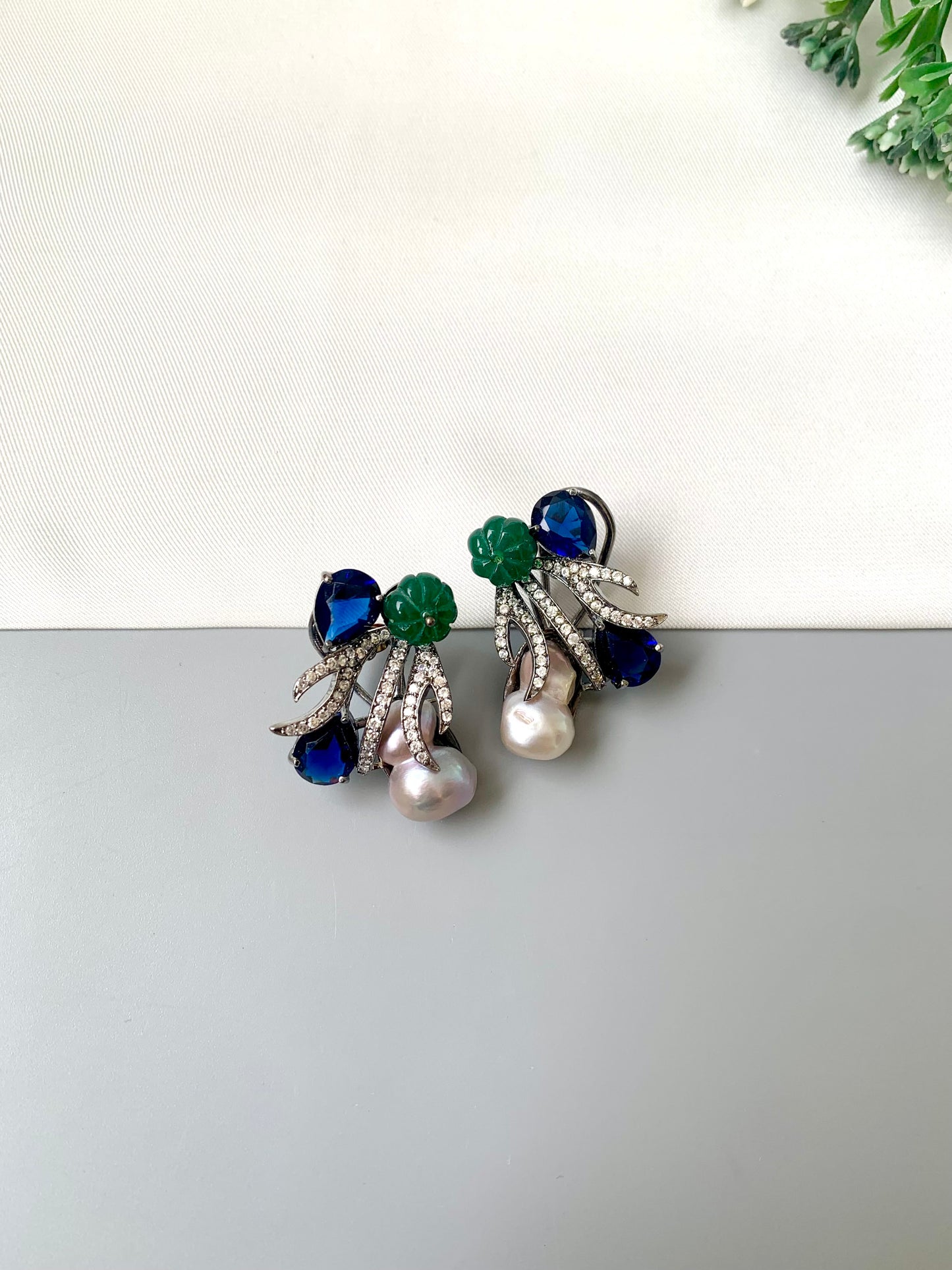 Petra sapphire baroque pearl studs in rhodium oxidized finish with melon beads and American diamonds