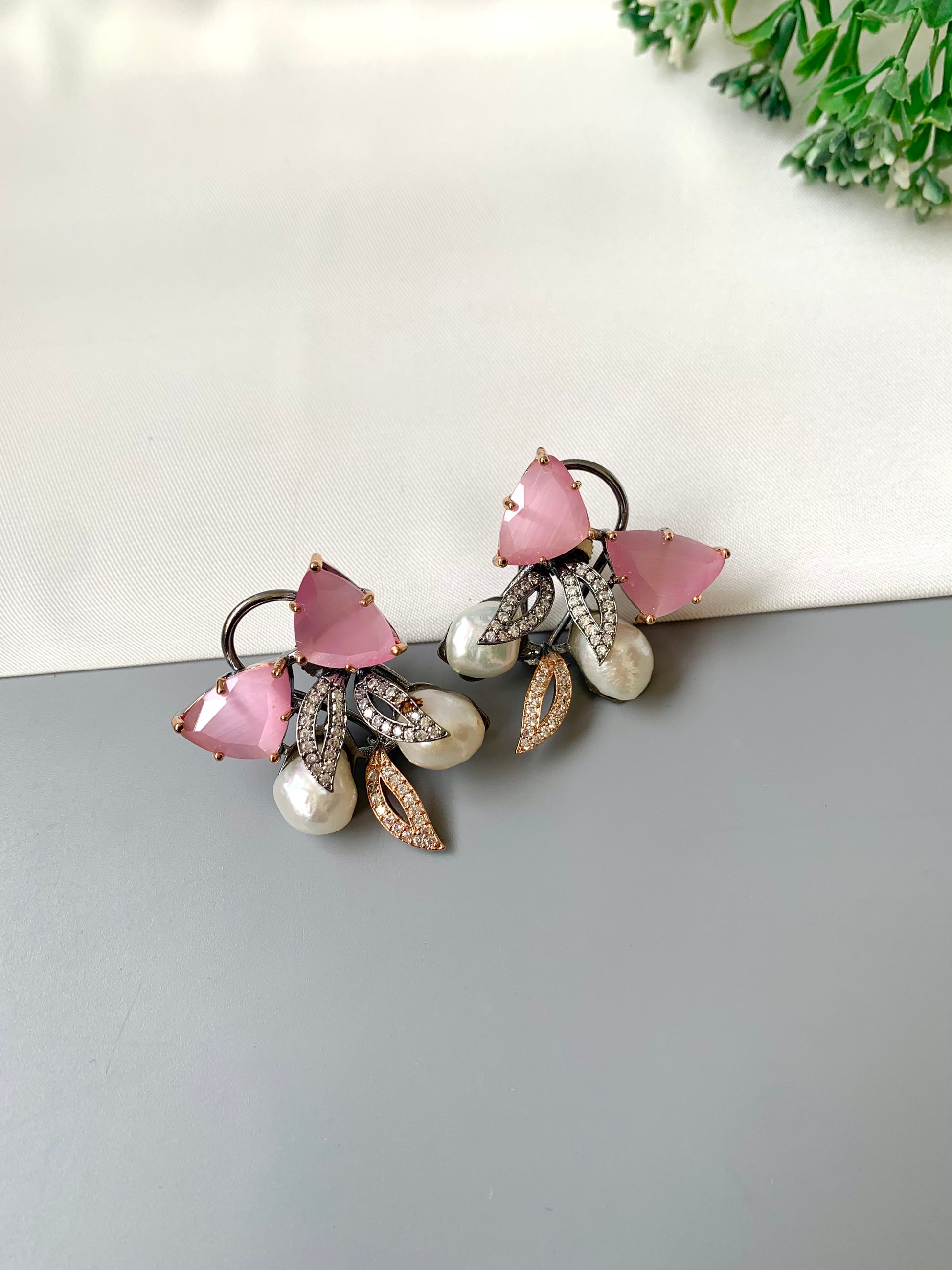 Ruby designer studs in rhodium diamond finish with baroque pearls and pink onyx stones