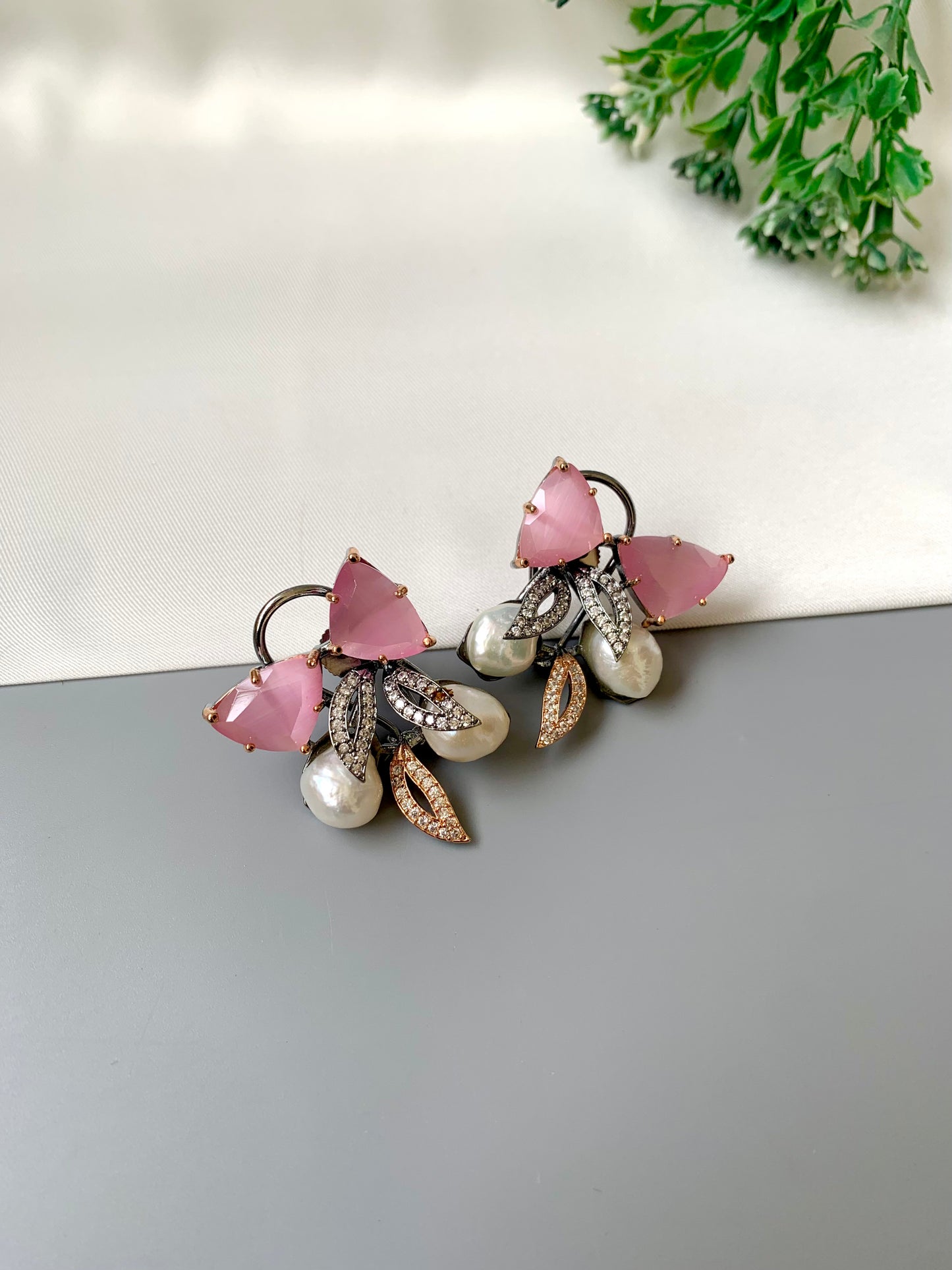 Ruby designer studs in rhodium diamond finish with baroque pearls and pink onyx stones
