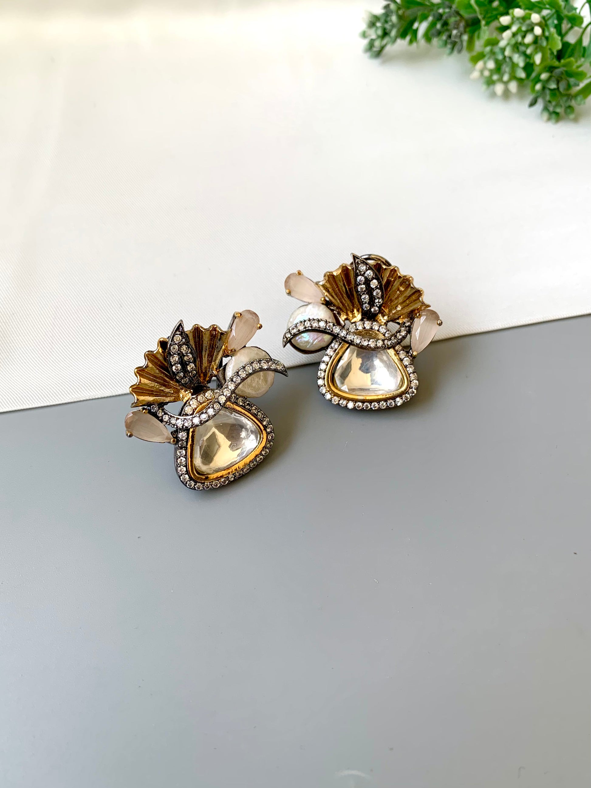 Polina polki kundan studs in 22kt gold plating with oxidized finish and baroque pearls