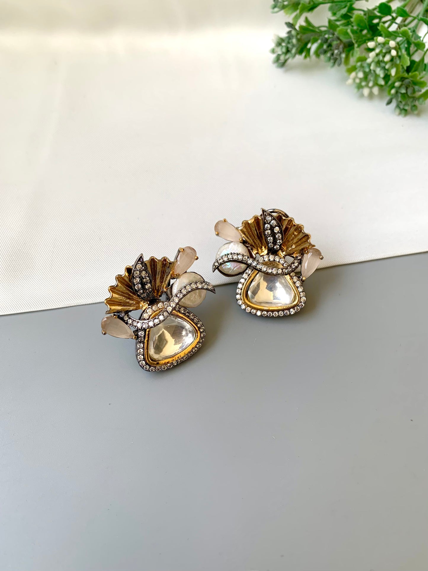 Polina polki kundan studs in 22kt gold plating with oxidized finish and baroque pearls