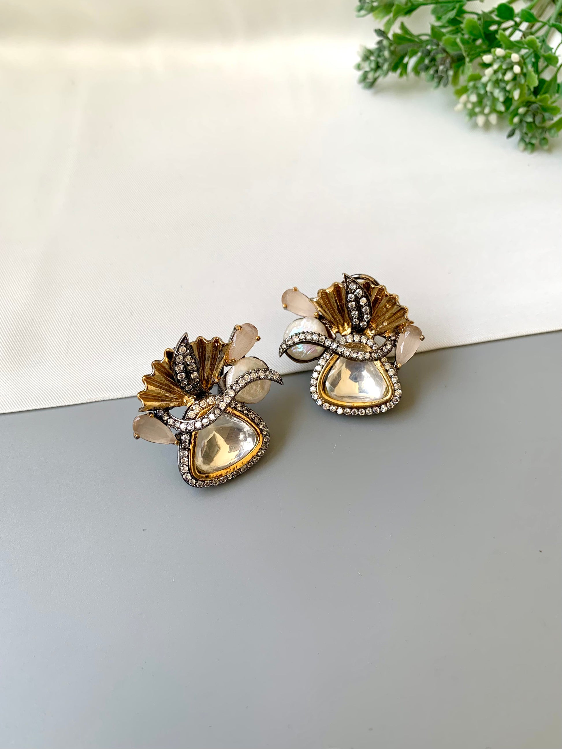 Polina polki kundan studs in 22kt gold plating with oxidized finish and baroque pearls