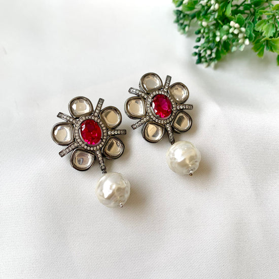 Ruby polki kundan earrings with baroque pearl drops in rhodium finish