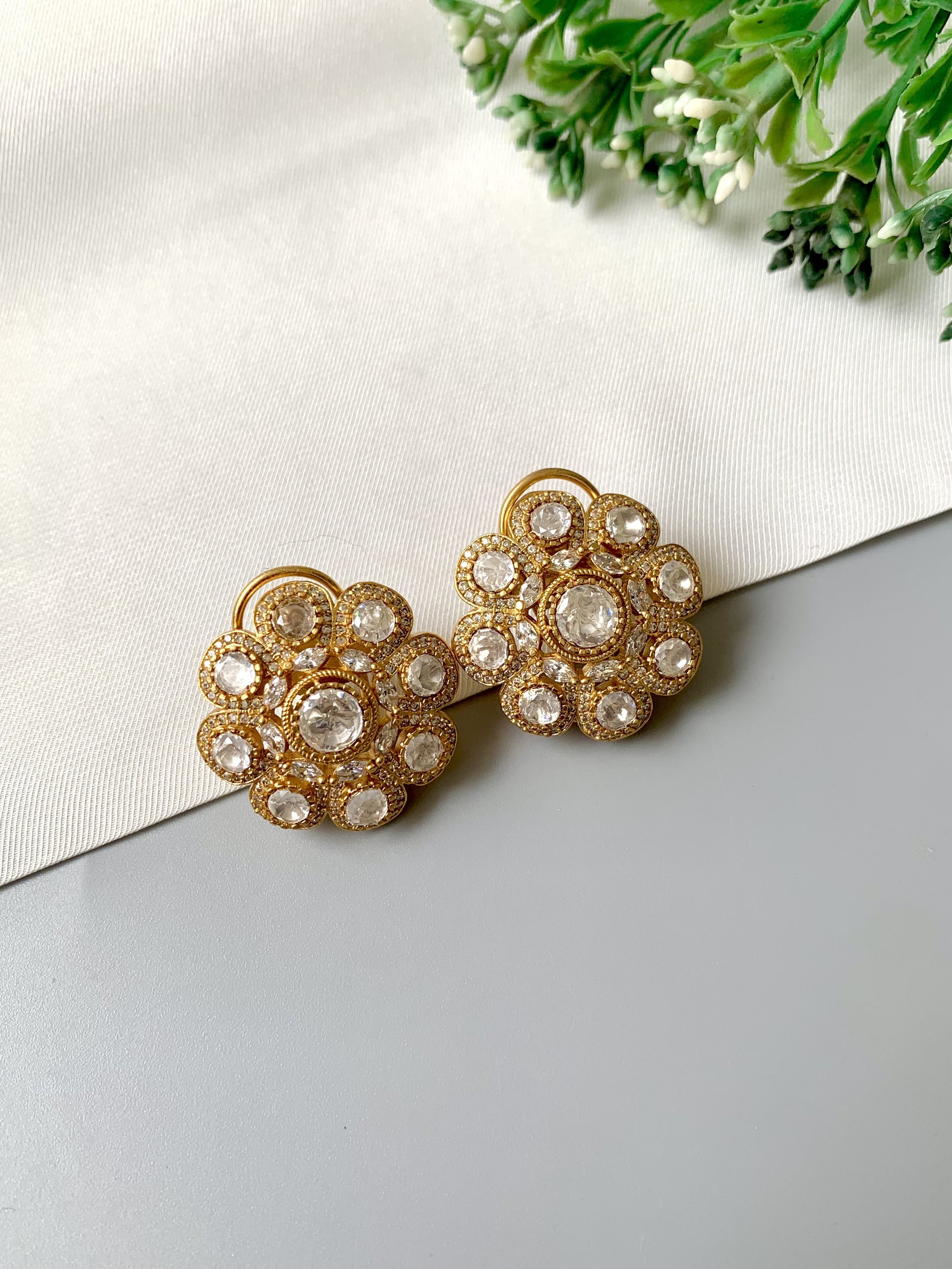 Video of Mehra floral studs with Moissanite diamonds and 22kt gold finish by Zamal Jewels