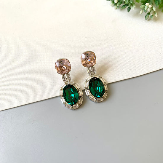Handcrafted rhodium plated platinum finish earrings with baguette stones and Swarovski crystals in emerald tone