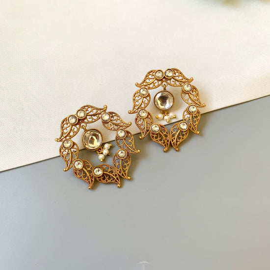Handcrafted 22kt gold plated designer earrings with Polki Kundan stones and semi precious pearl detailing