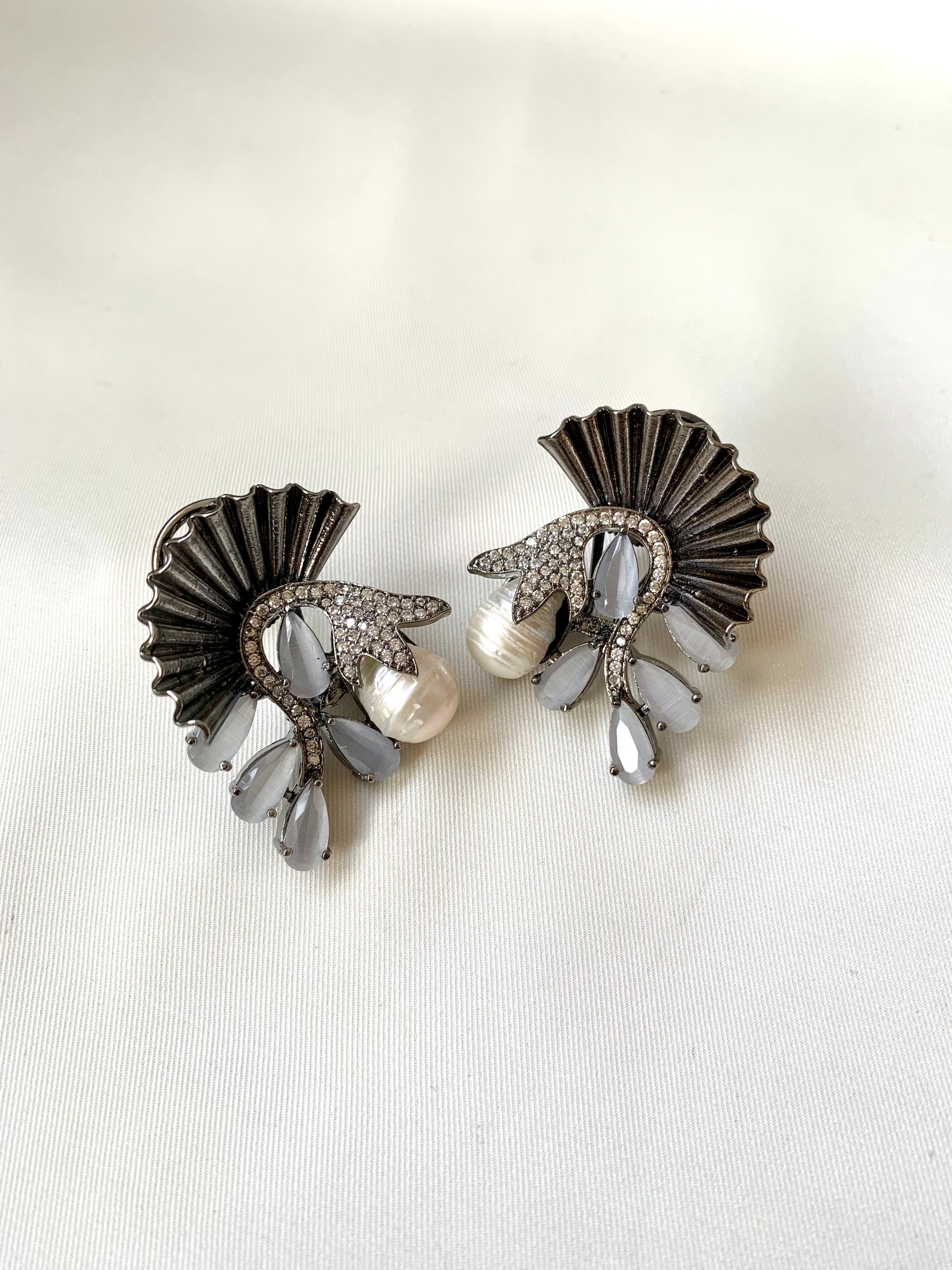 Ravaa grey designer earrings in rhodium plating with baroque pearls, American diamonds and semi-precious grey onyx